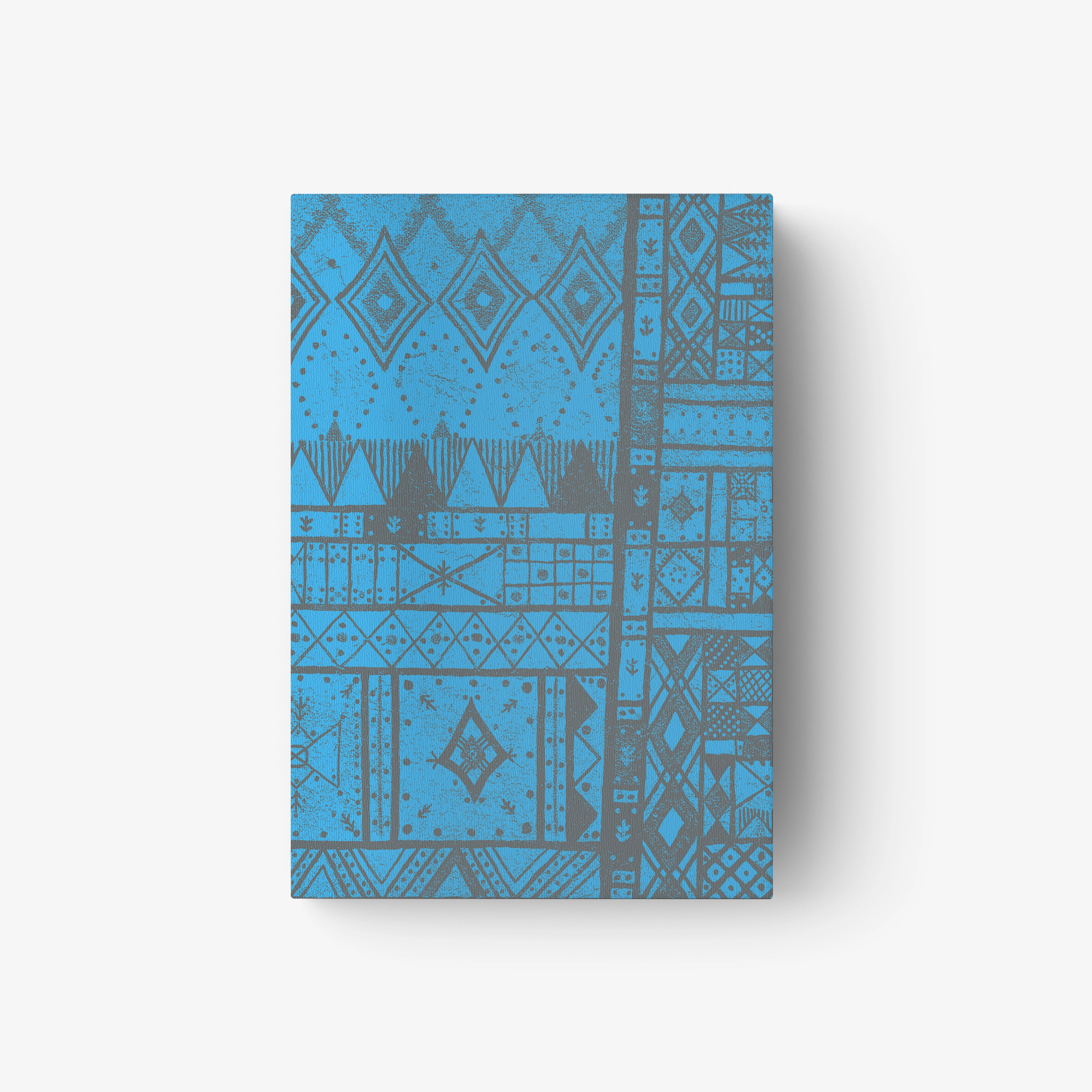 Blue patterned book cover with geometric motifs and abstract design