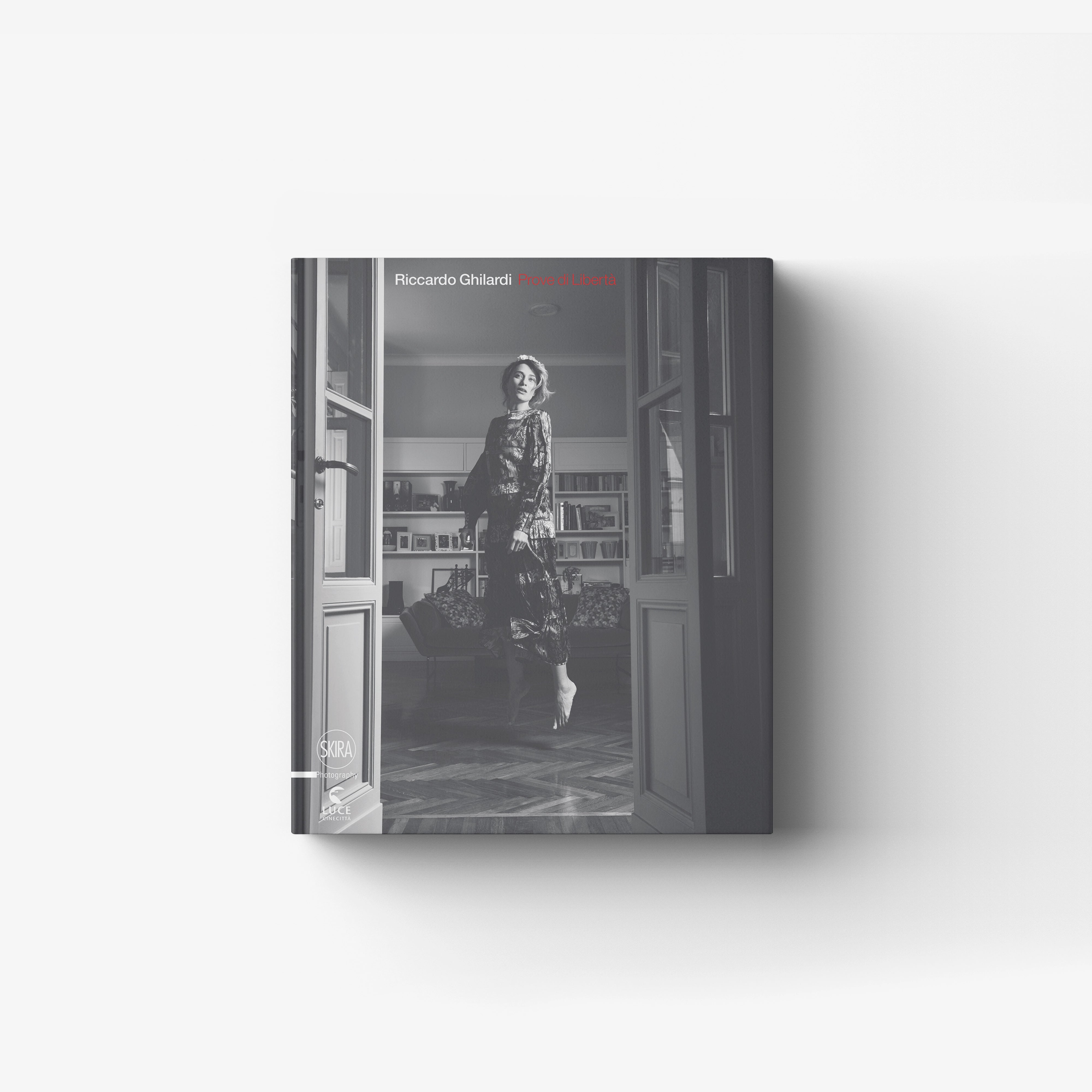 Black and white photography book Skira Arte Riccardo Ghilardi Prove di libertà with cover showing a woman in a doorway