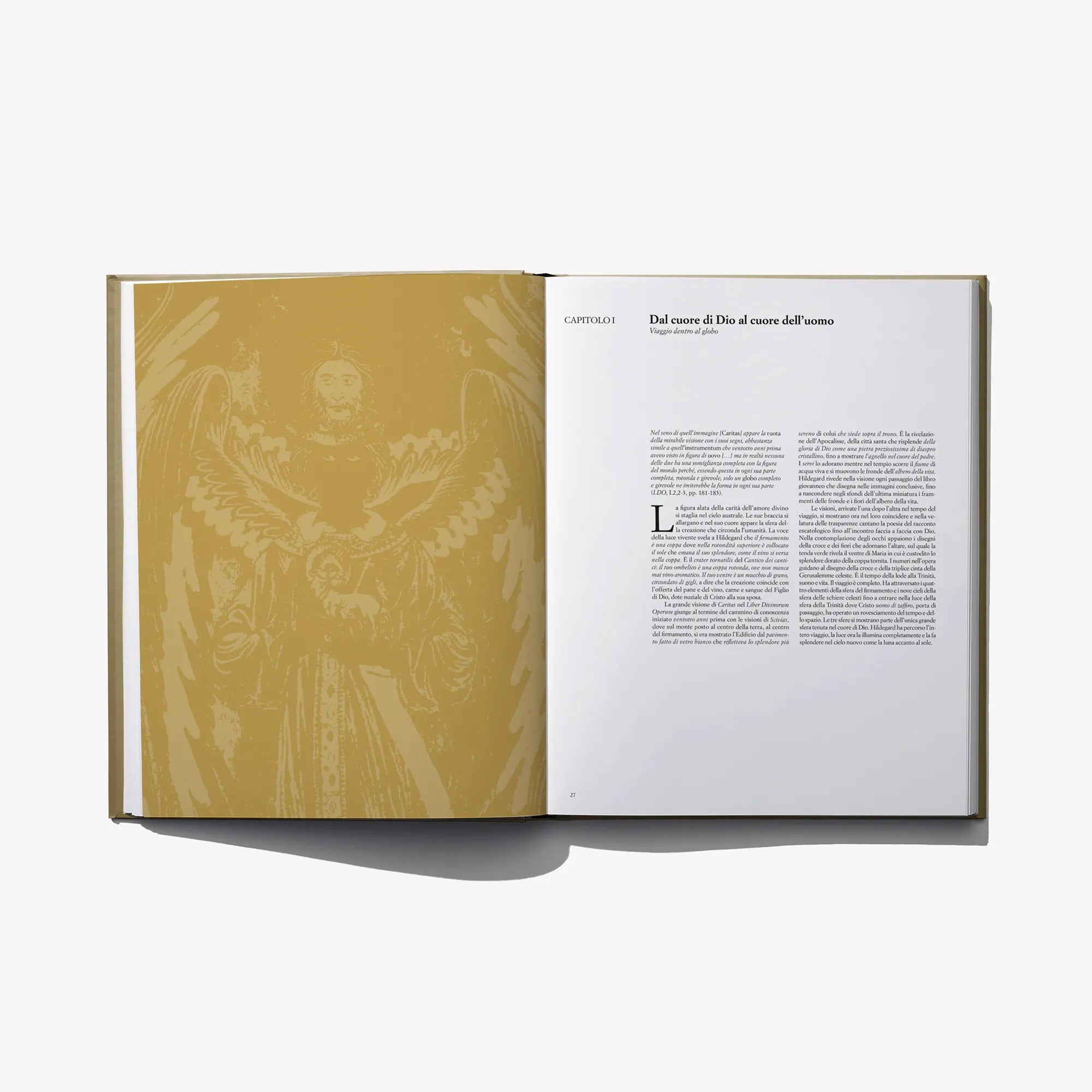 Open hardcover book with yellow-toned page art on left and text on right