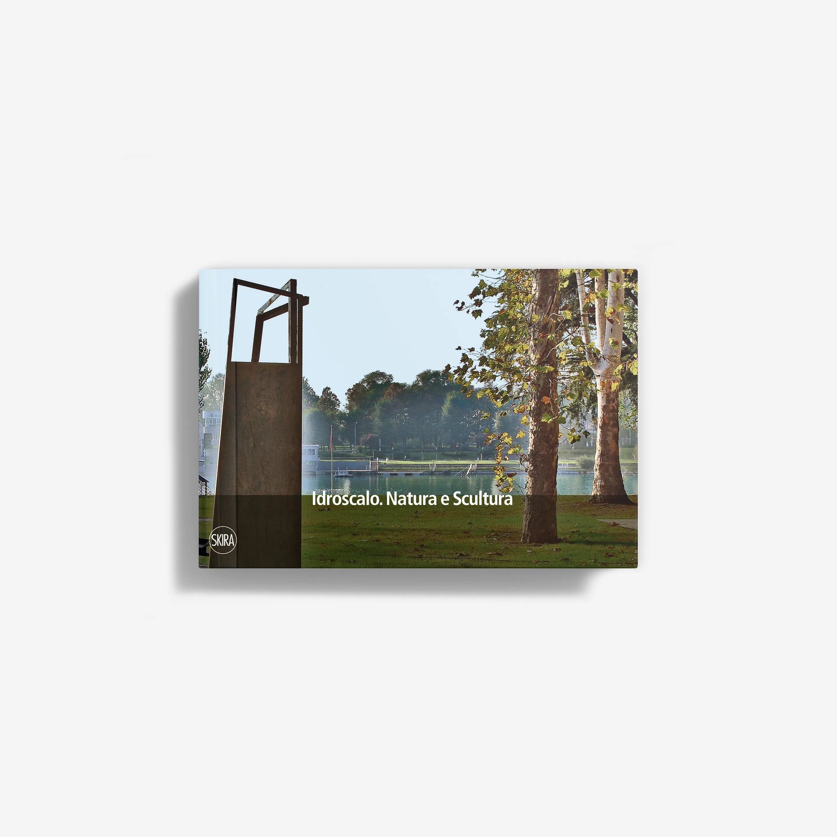 Landscape art print with trees, grass, and a dark sculpture frame