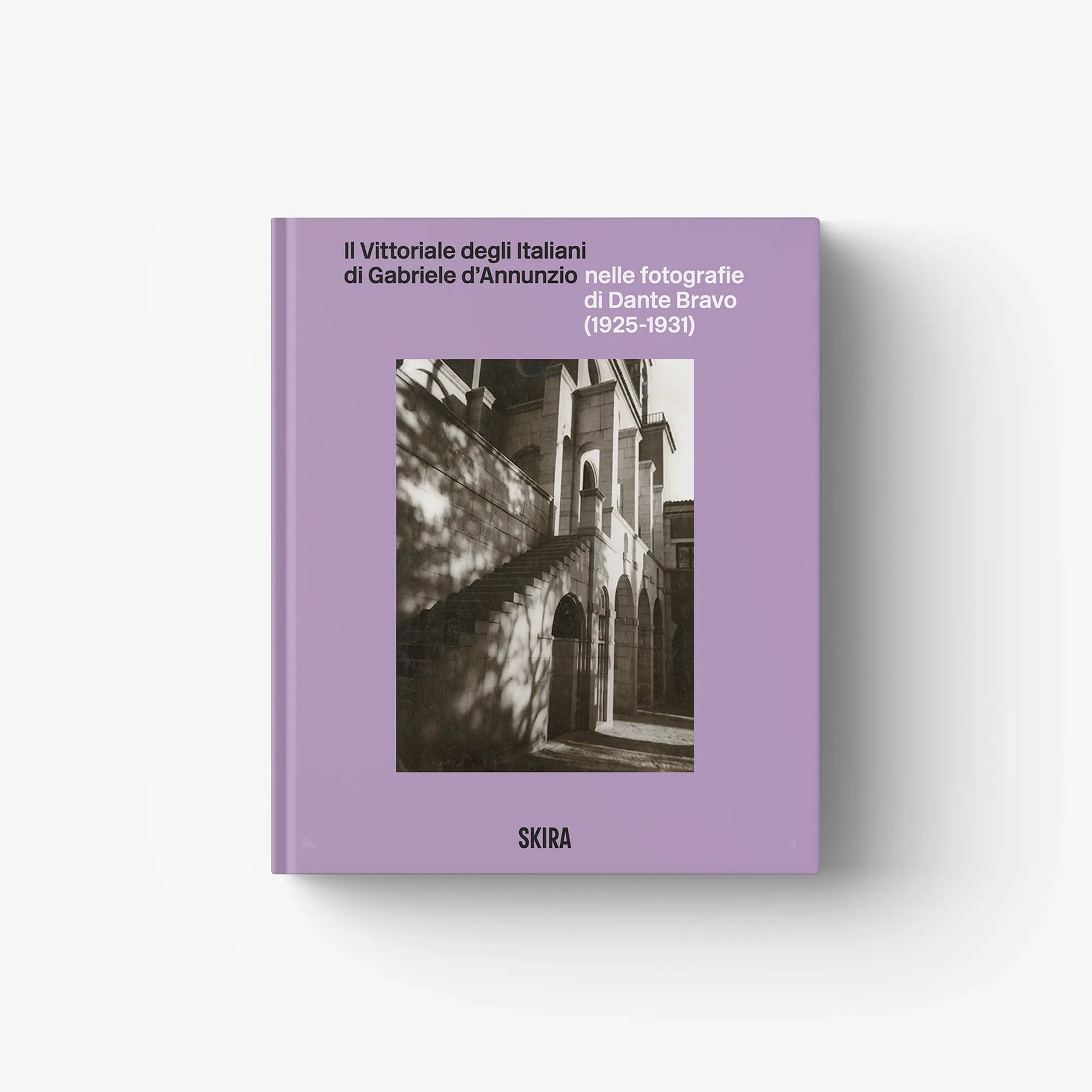 Purple hardcover photo book with title text and SKIRA logo on front cover