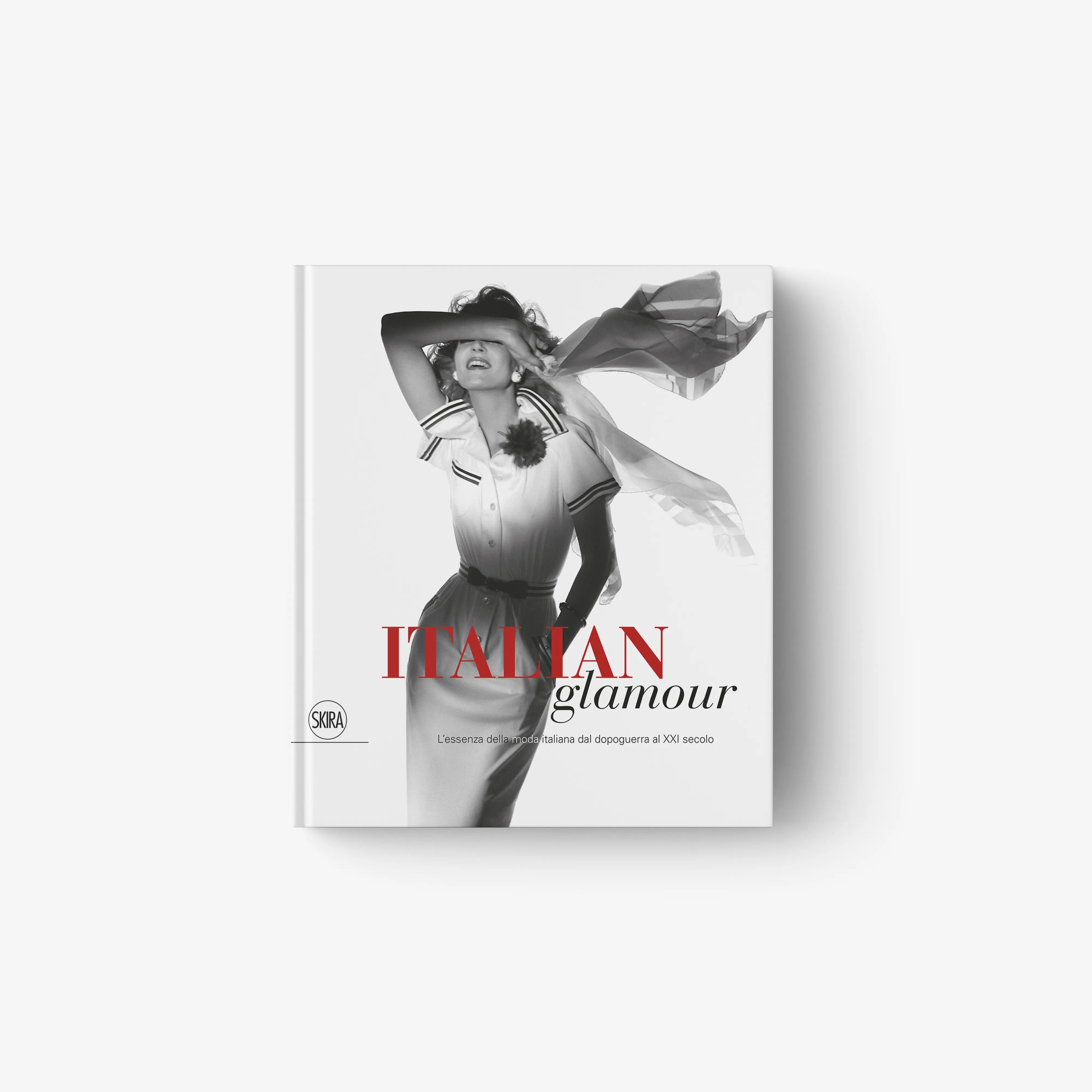 Fashion magazine cover featuring a black-and-white model in a striped dress with wide hat