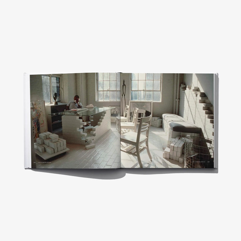 Open book page with a photo of an office/model room and stacked furniture models