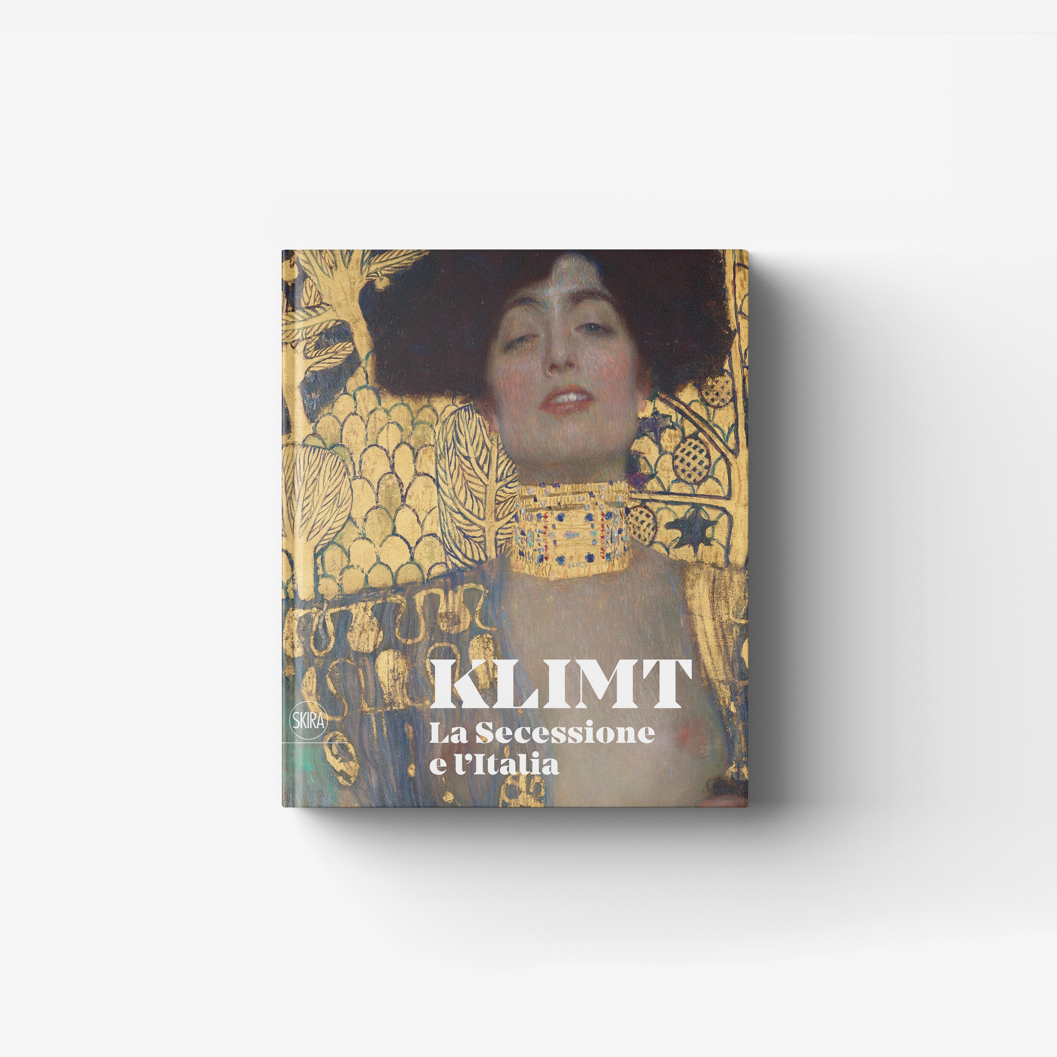 Art book with Gustav Klimt portrait cover in gold and blue by Skira Arte, modern monograph catalogue about Italy and Rome