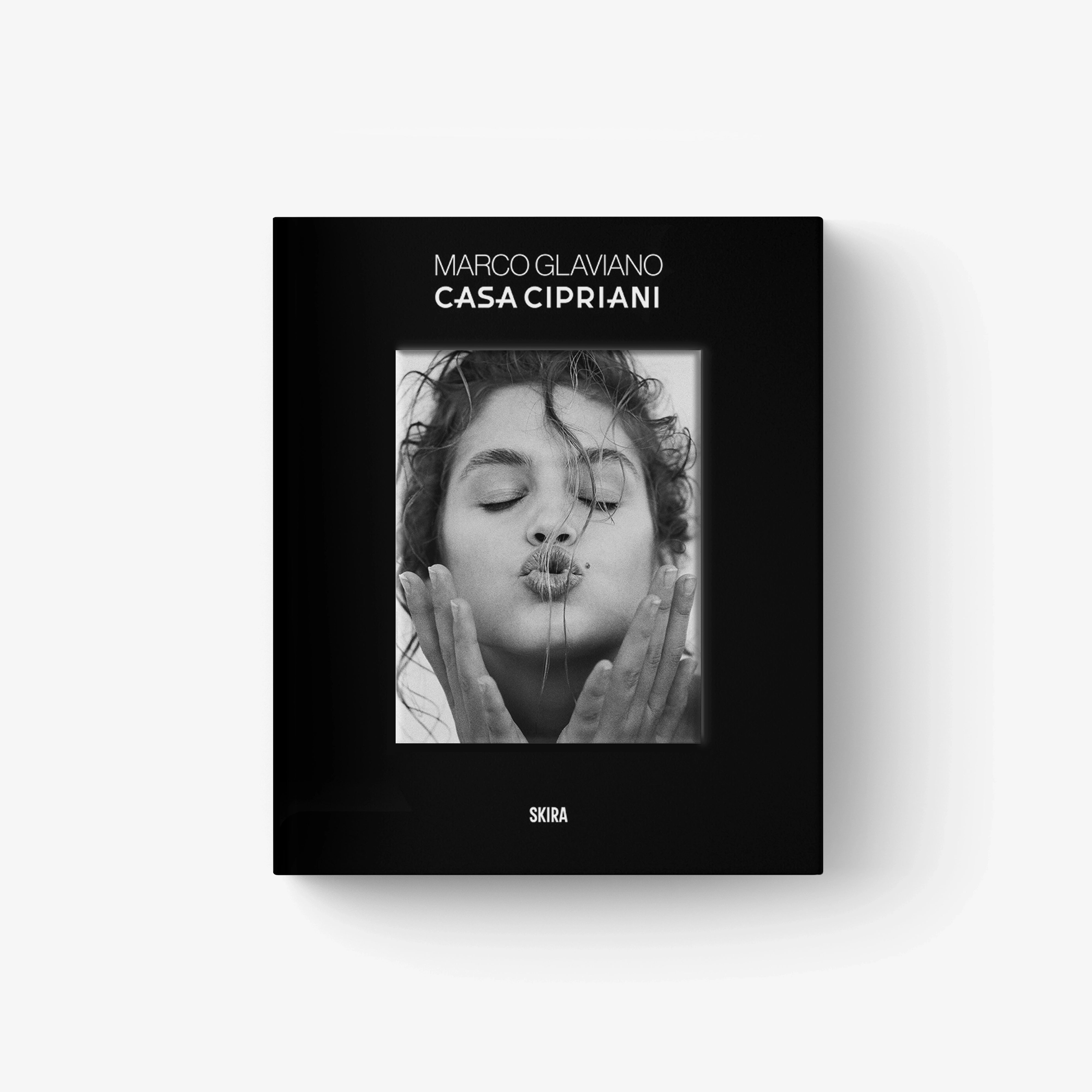Black hardcover photo book cover with black-and-white portrait and logo text
