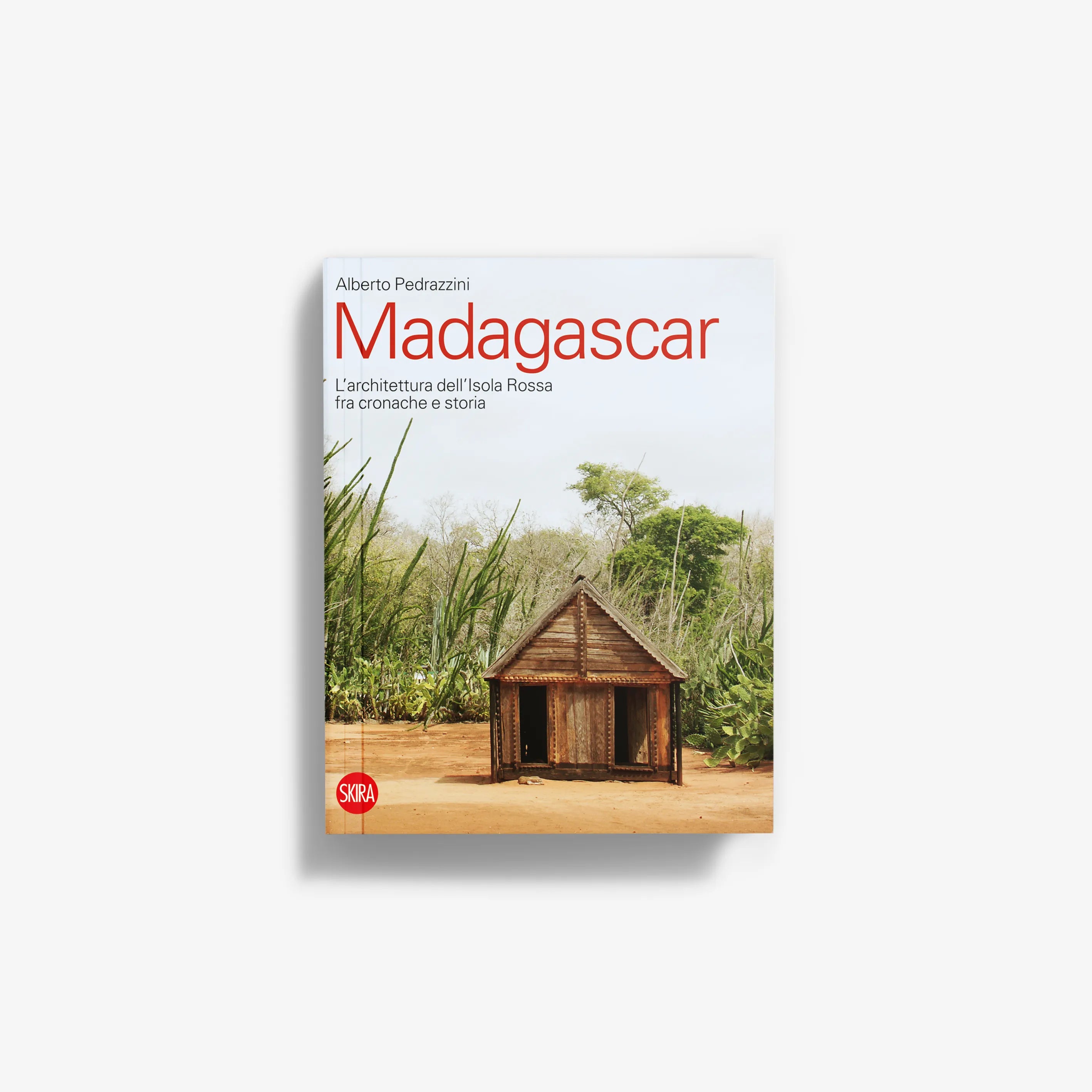 Madagascar travel book cover with illustrated hut and green savanna scene