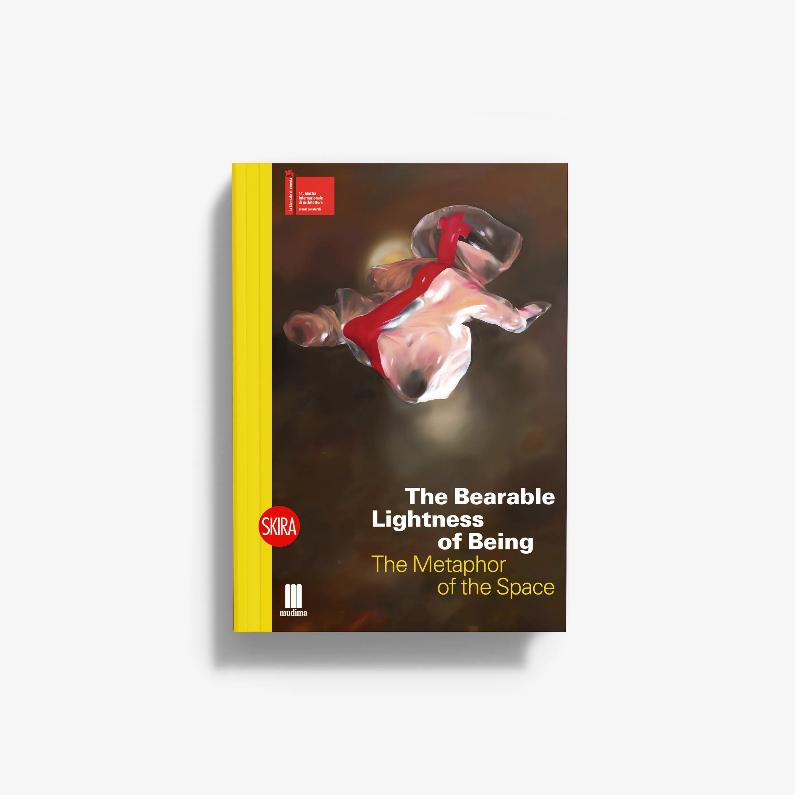 Paperback book with brown cover, red-and-white abstract figure, yellow spine, SKIRA logo