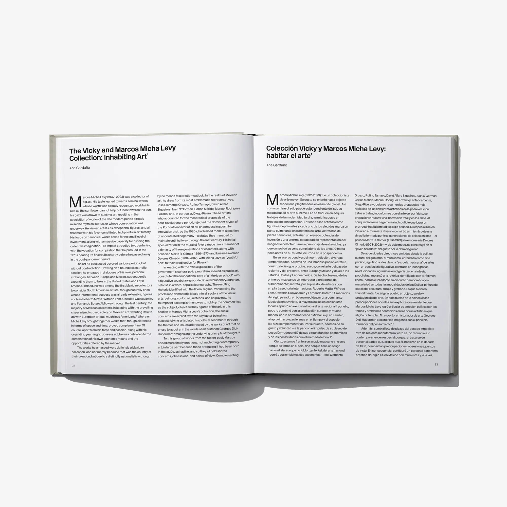 Open art book with two pages of printed text and headings