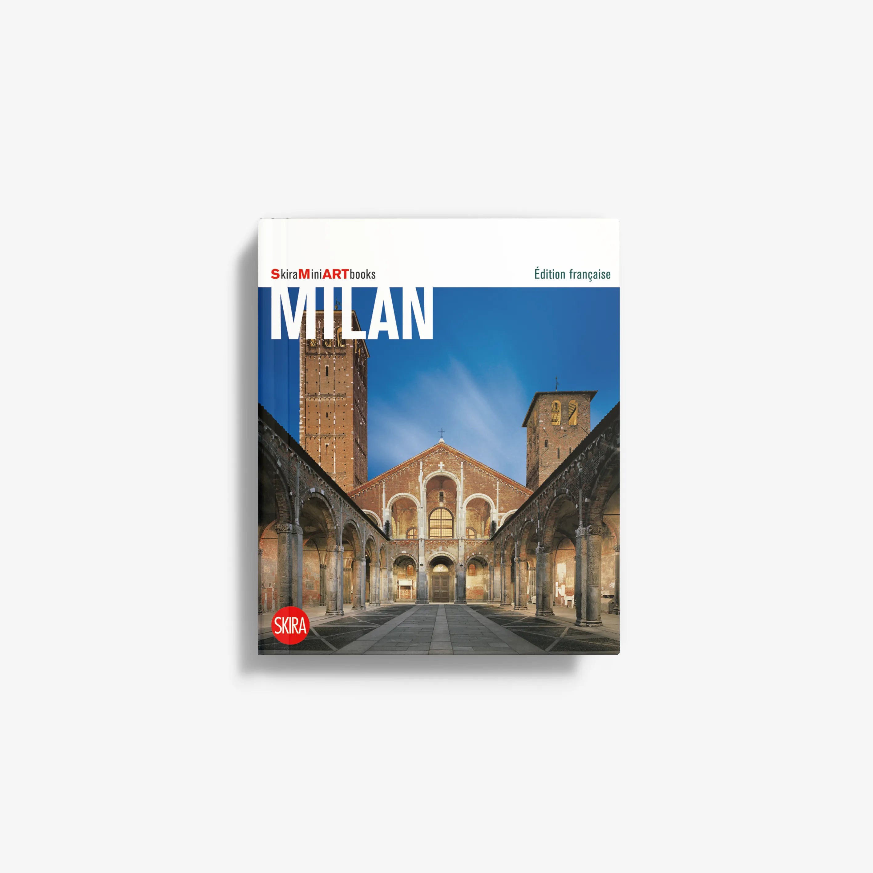 French edition travel book cover, blue cityscape with Milan cathedral and arches
