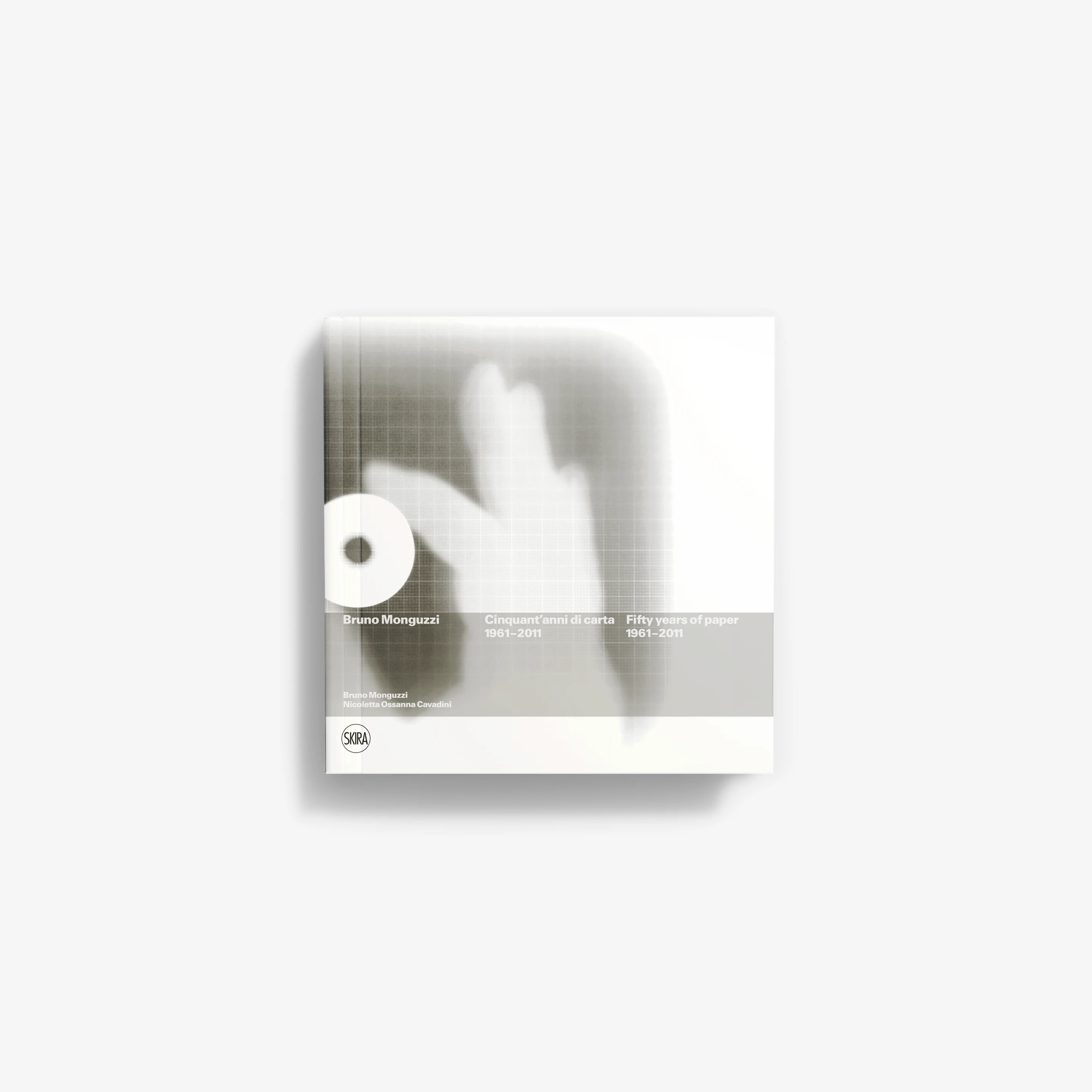 Art book with light gray cover featuring white hand silhouette and small title text