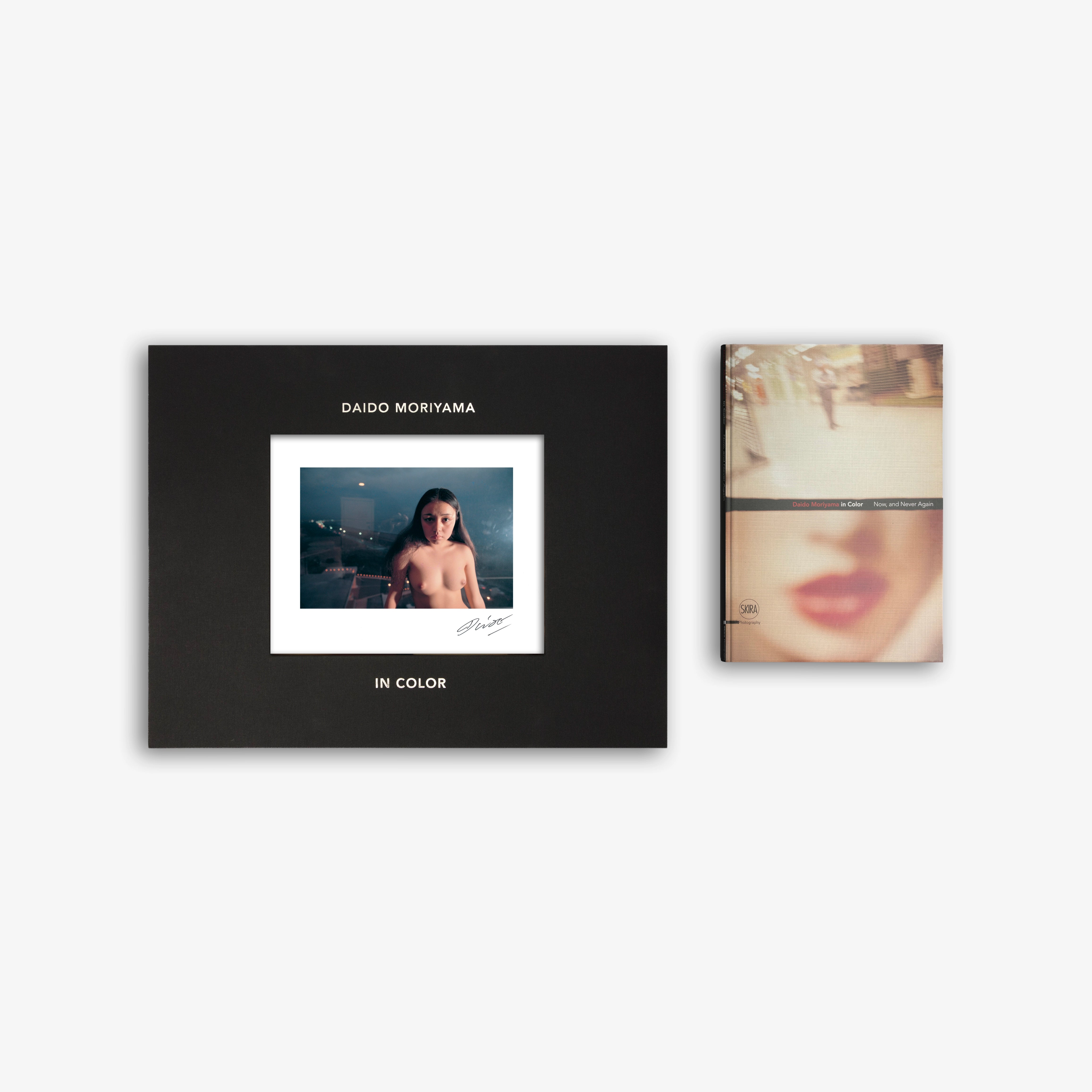 Limited edition art book with black cover and framed color photo, nude figure.