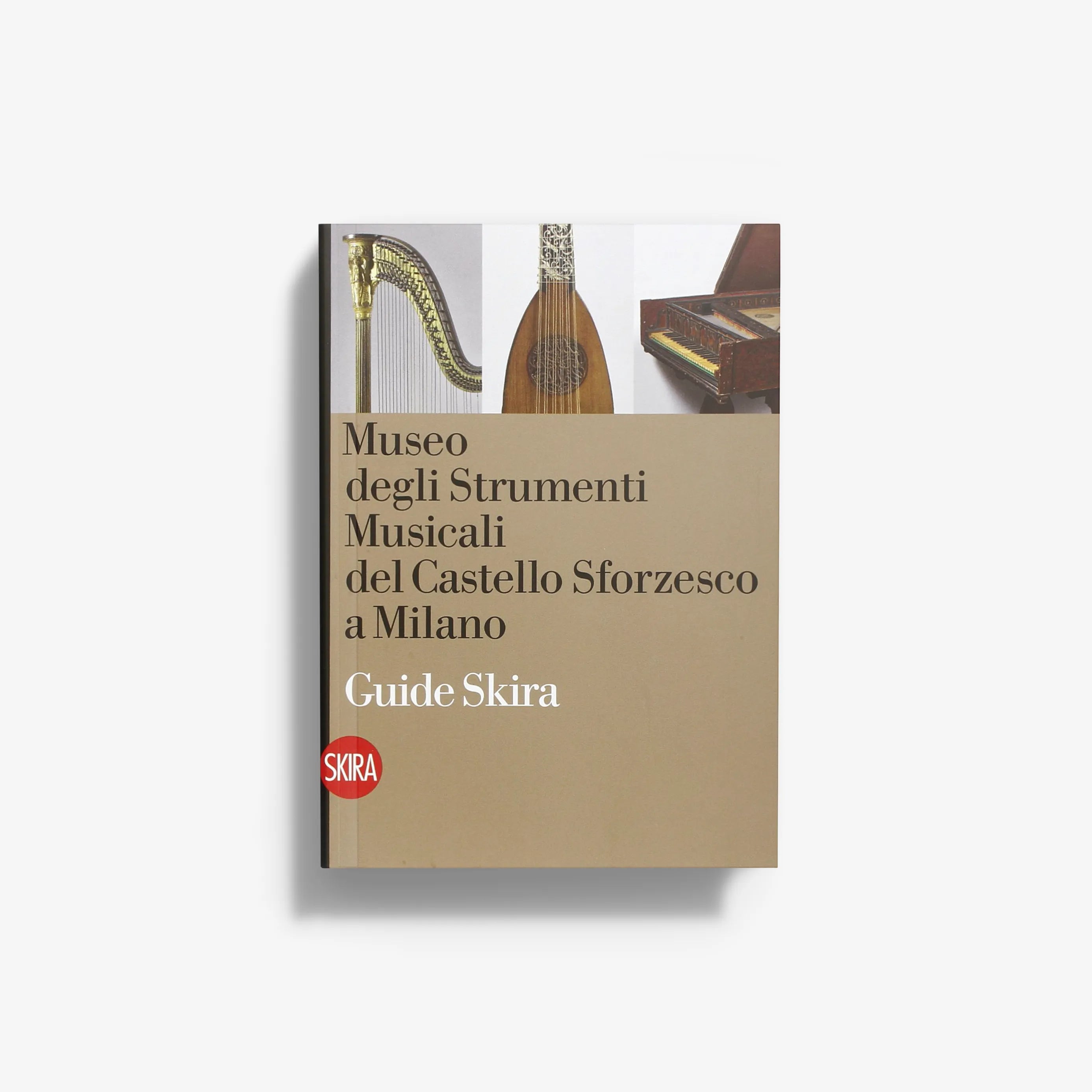 Music museum guide book with beige cover and illustrated musical instruments