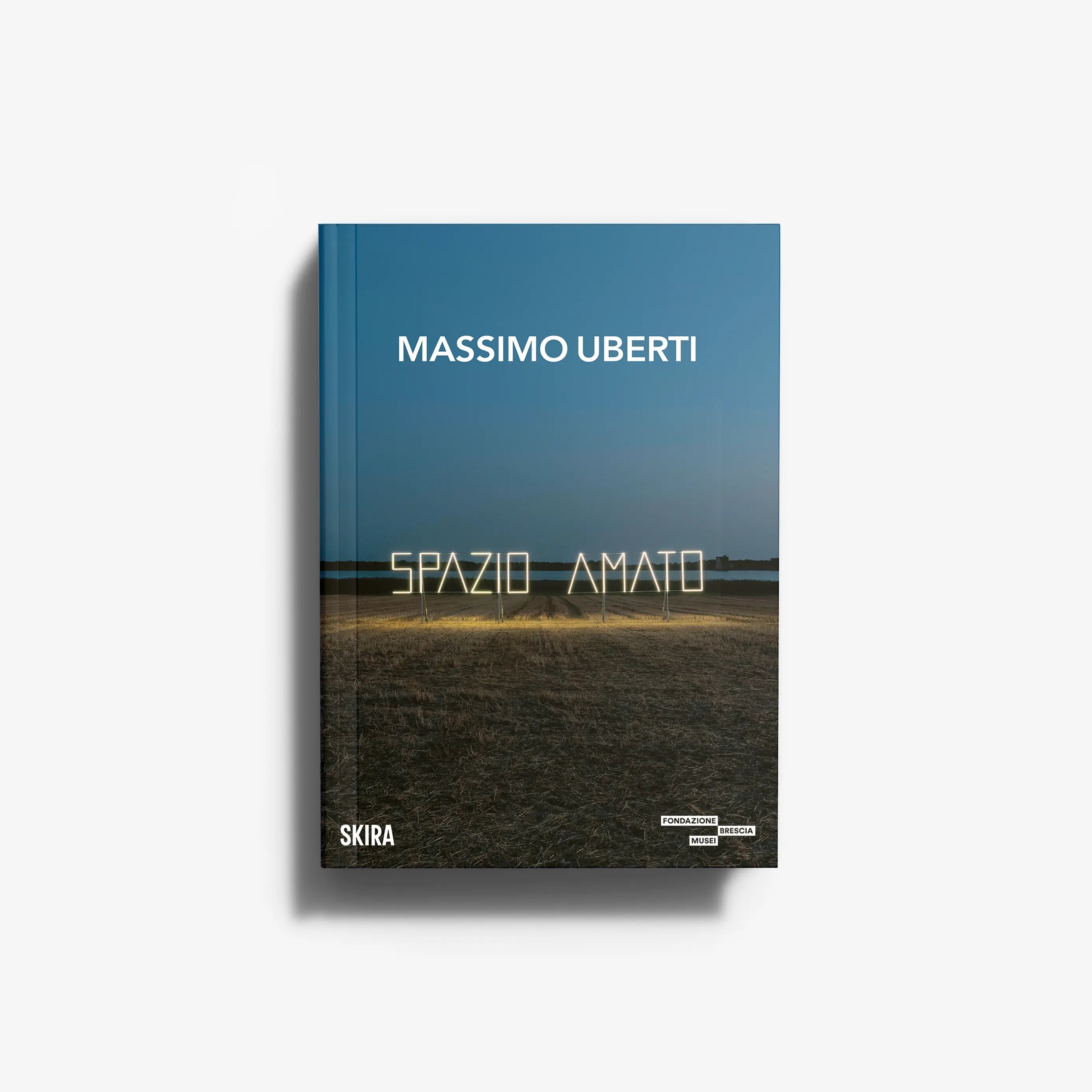 Contemporary art monograph by Skira Arte, Massimo Uberti, blue cover with neon light investigation