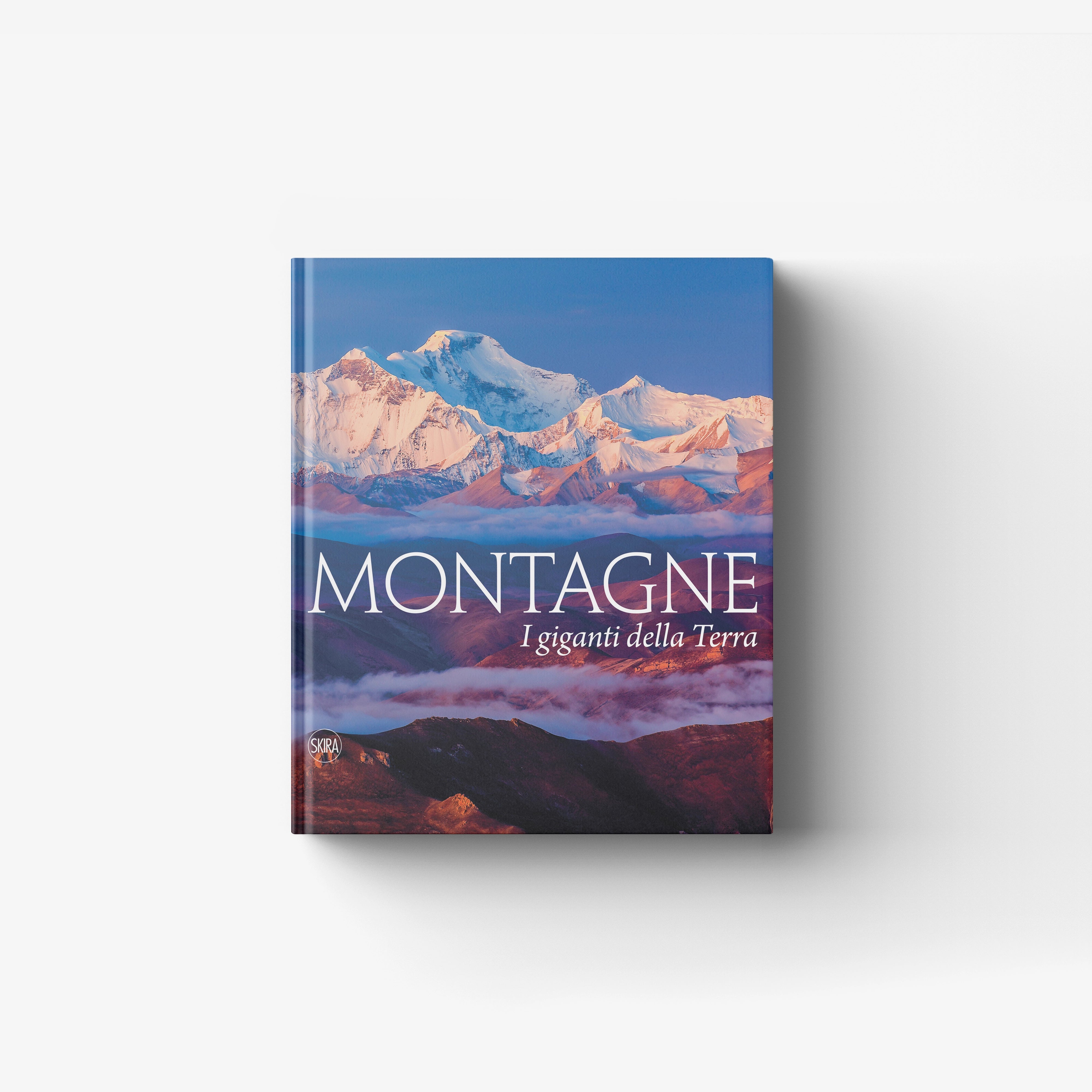 Illustrated mountain landscape book by Skira Arte, Montagne I giganti della Terra, with blue and snowy peaks