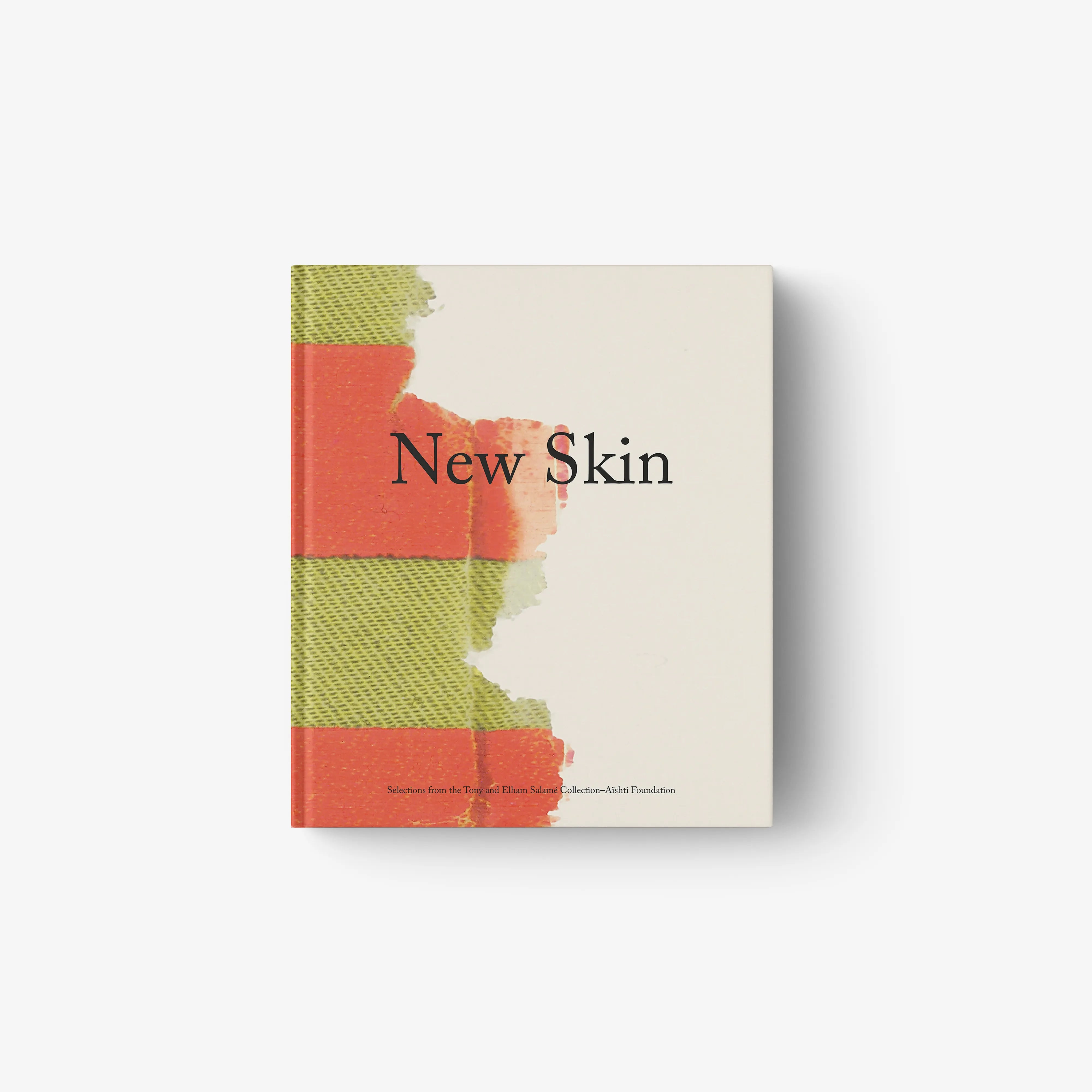 Hardcover book with beige cover and green and orange color-block panel design