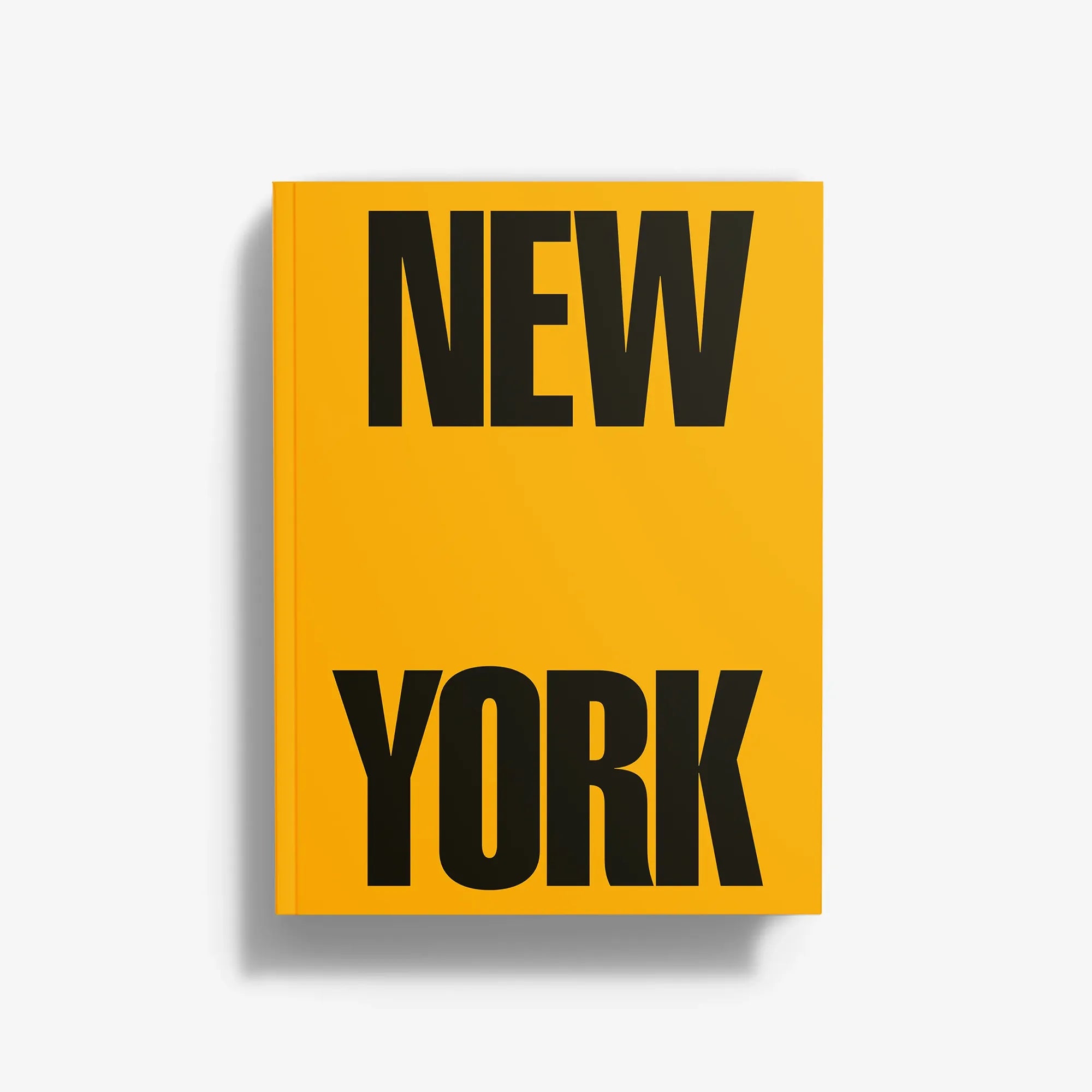 Yellow book cover with large black “NEW YORK” title lettering