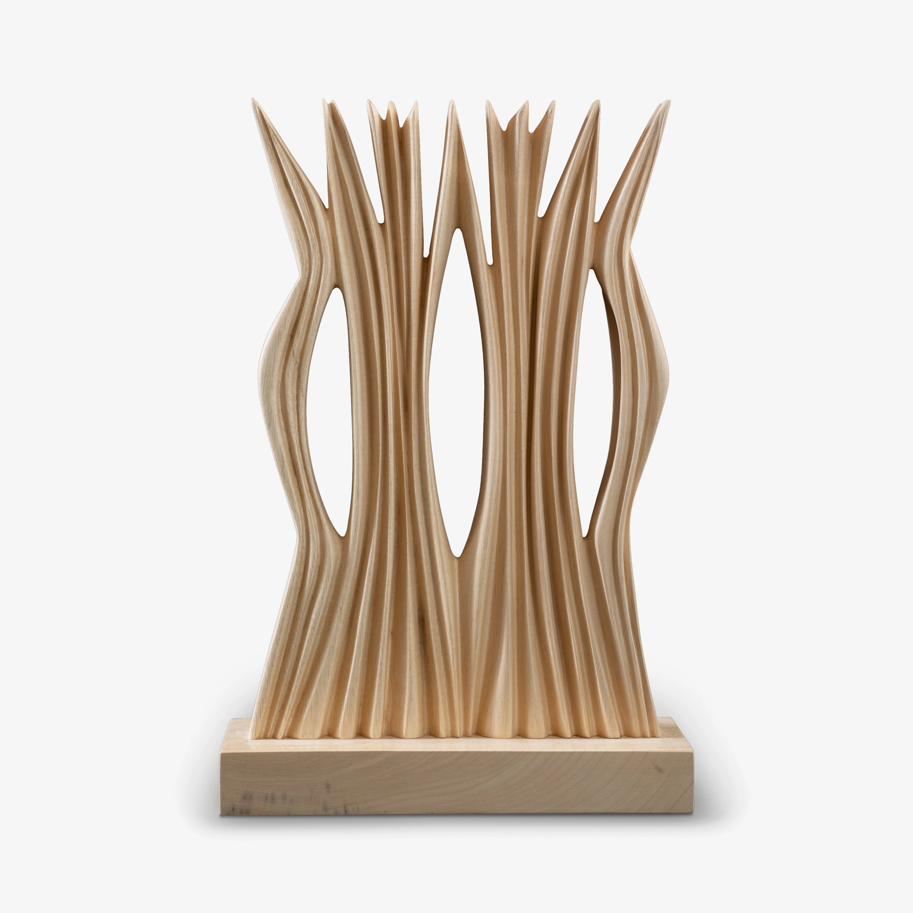 Abstract wood sculpture with vertical cut-out slats and rectangular base