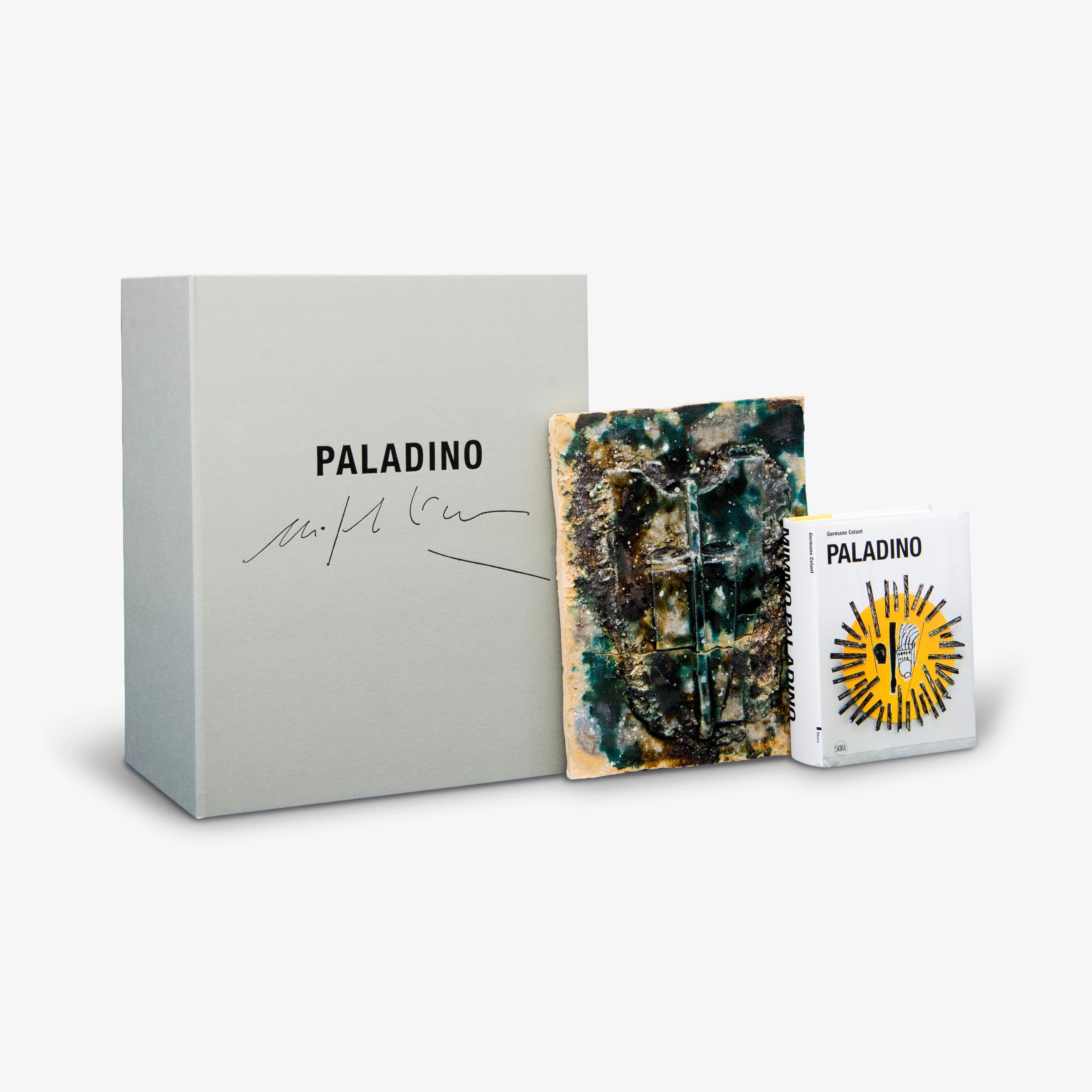 Limited edition Mimmo Paladino set with abstract textured book cover, art-themed booklet, and gray storage box.