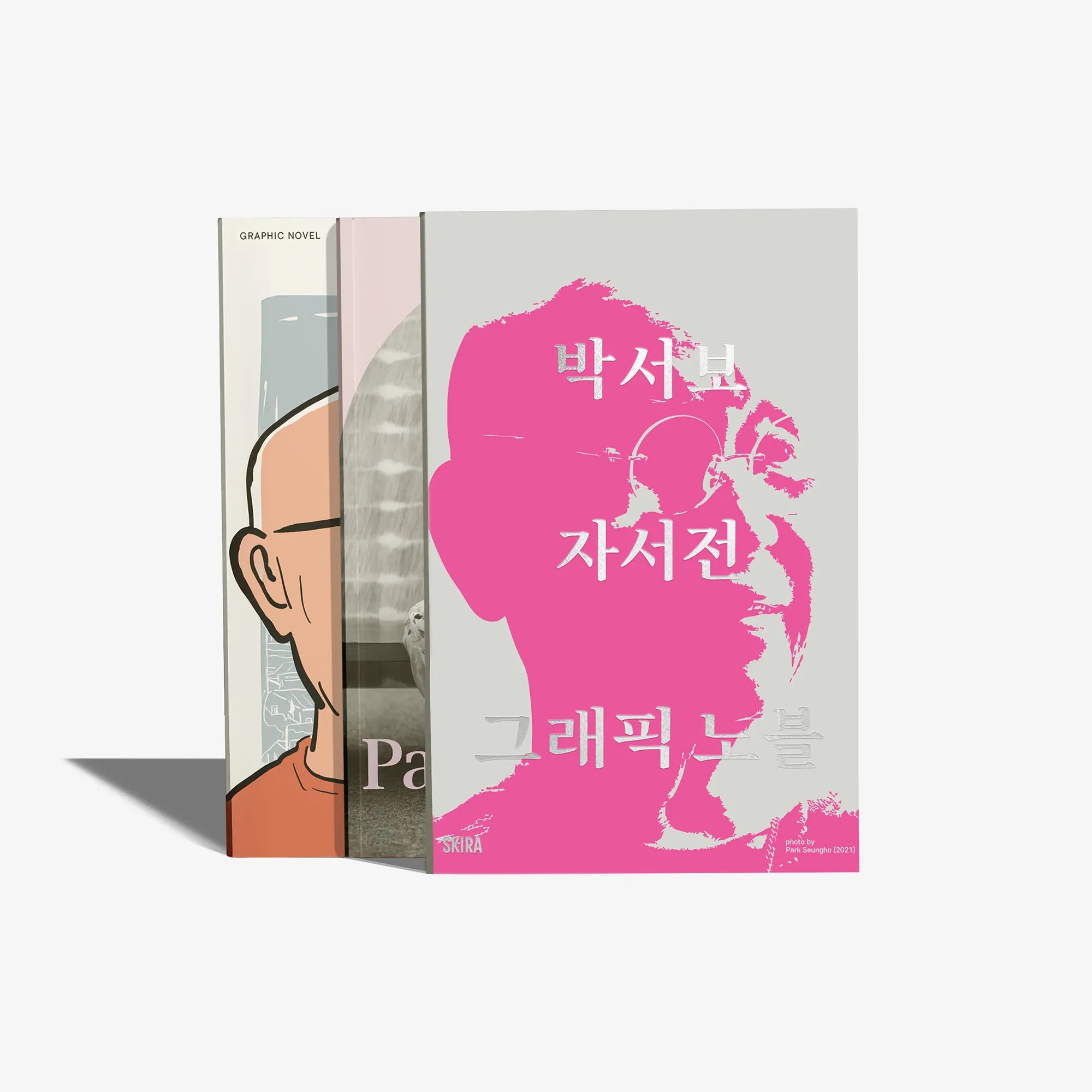 Korean edition graphic novel, pink illustrated cover with portraits and title text