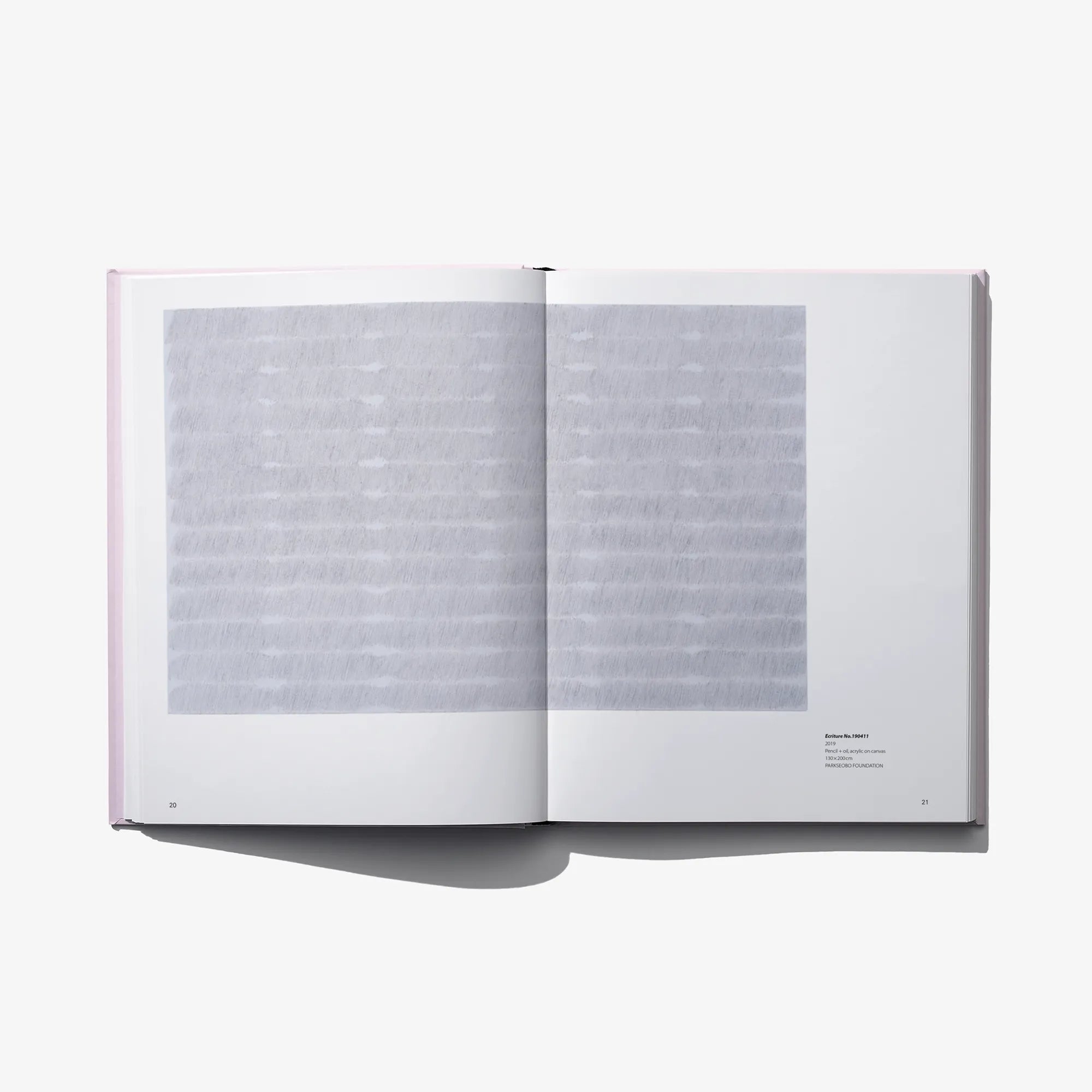 Opened autobiography graphic novel showing two pages with gray block graphics
