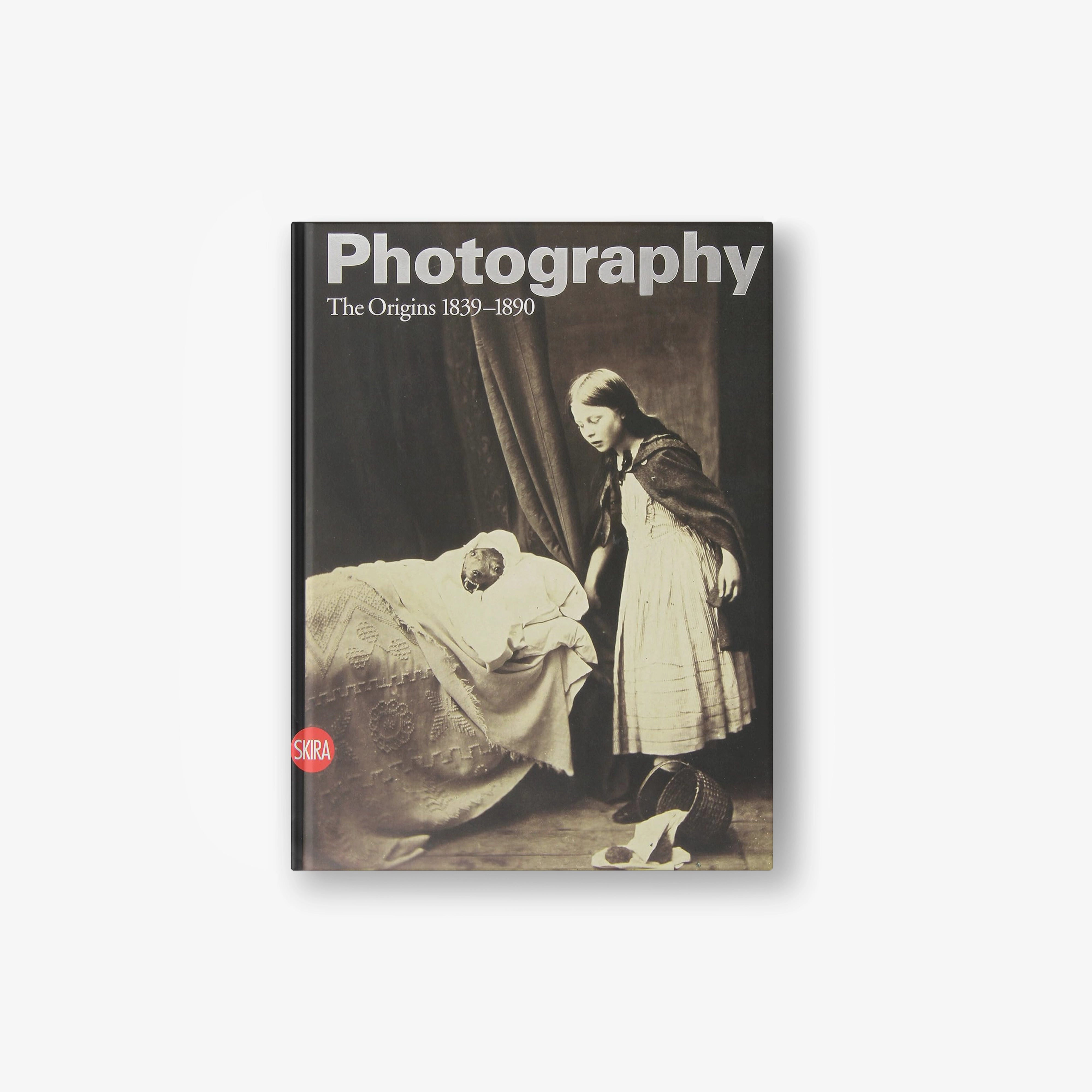 Photography book, dark cover with sepia portrait and “Photography”/1839–1890 text