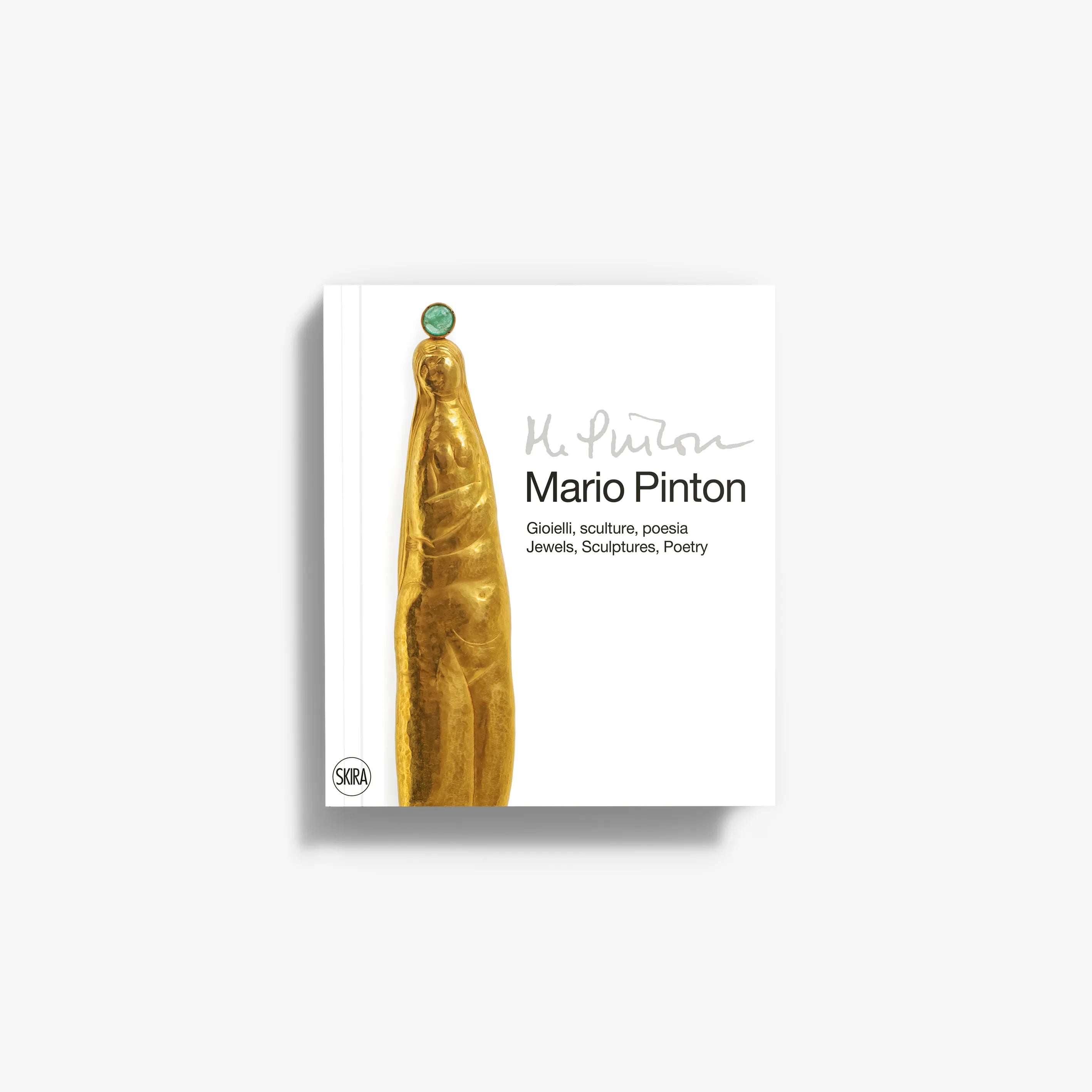 White book cover featuring a gold sculpted finger with a green jewel on top and black text with the title Mario Pinton.