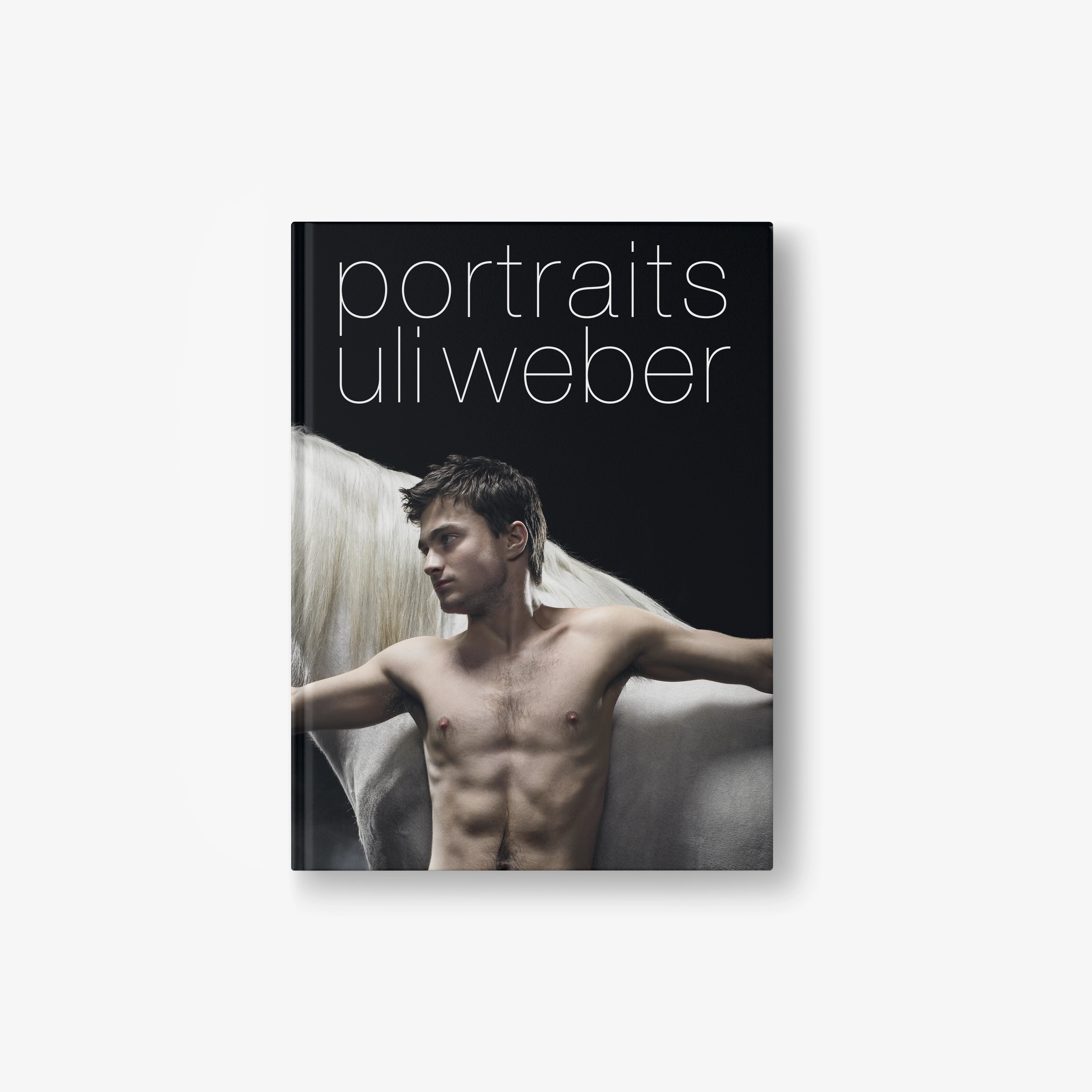Portraits photo book with Uli Weber cover, black design with nude male portrait