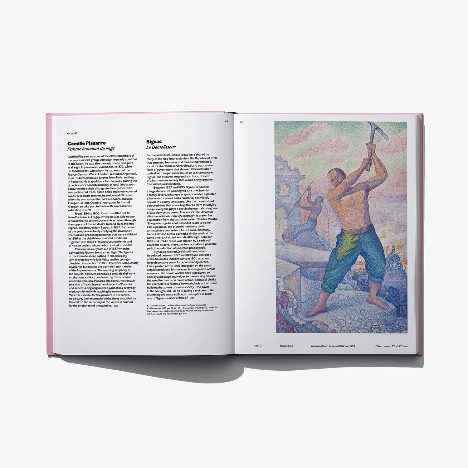 Open art book with printed text on left and colorful painting scene on right