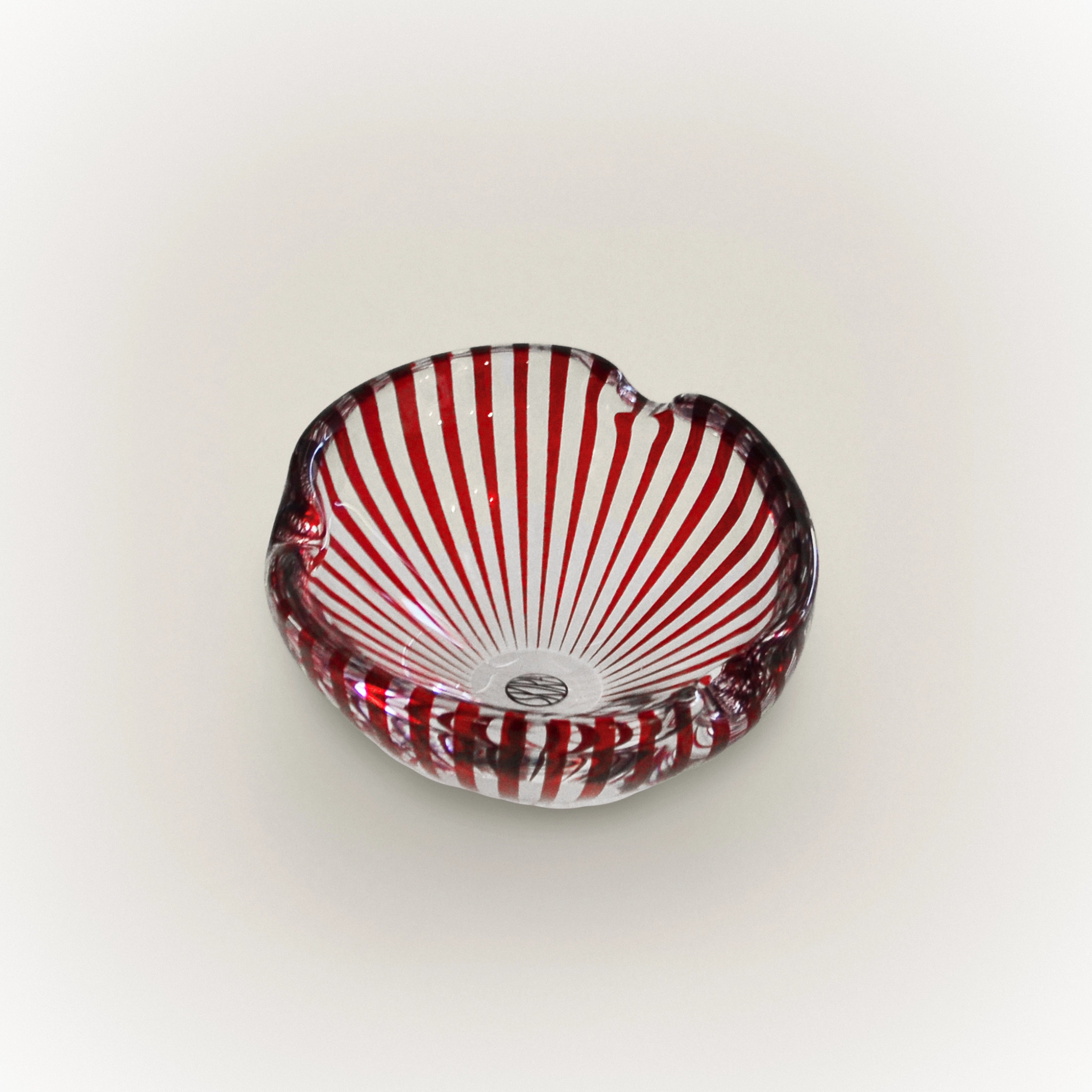 Glass tray with red-and-white striped pattern and scalloped rim