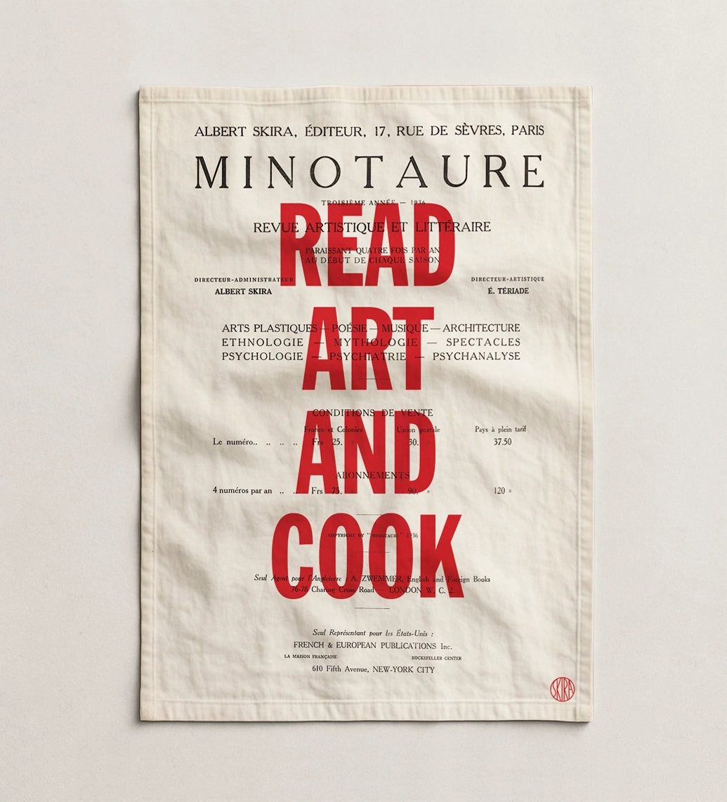 White kitchen towel with bold red READ ART AND COOK text and smaller black typography