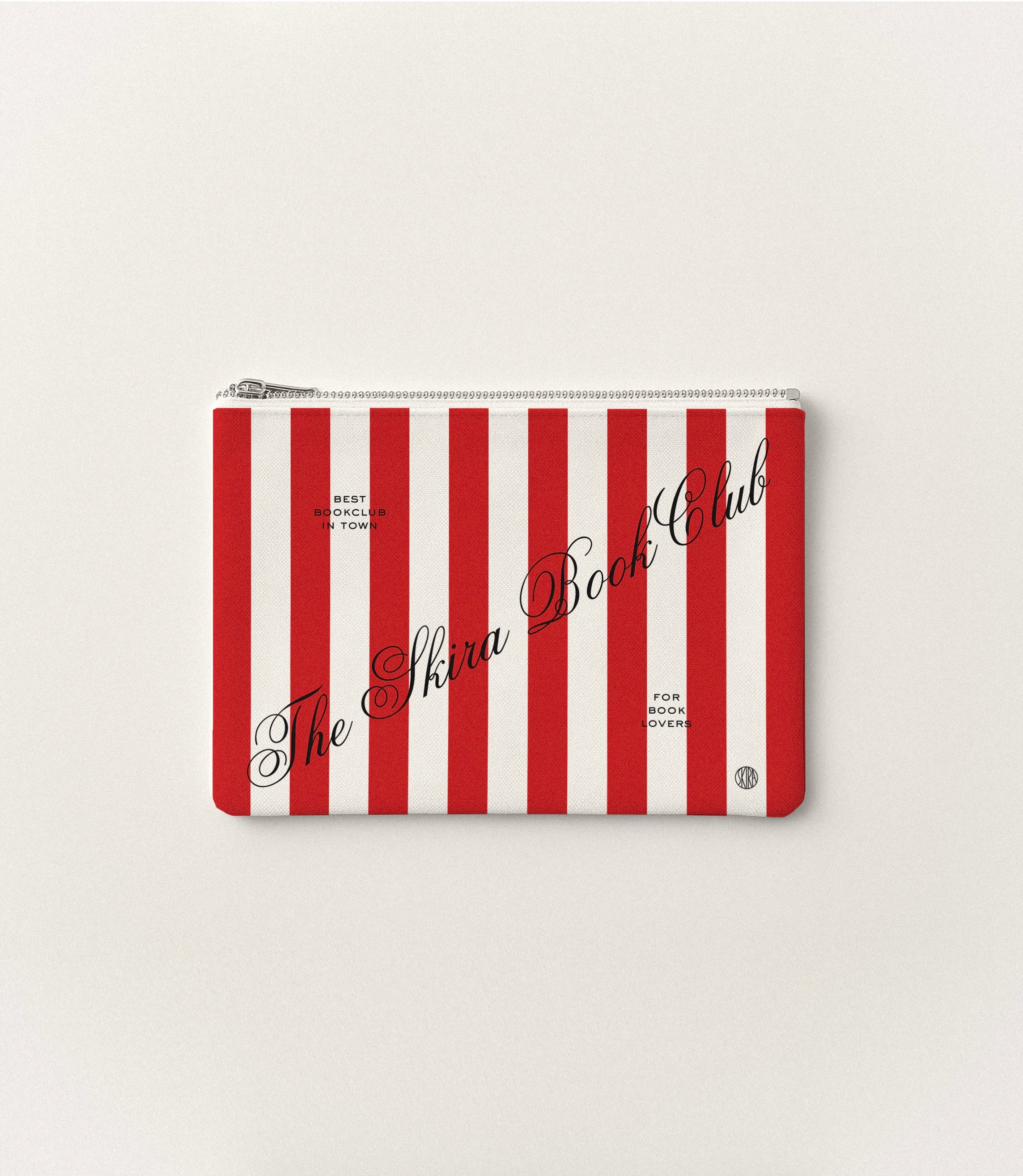 Striped zip pouch with red and white vertical stripes and “Skira Book Club” script text