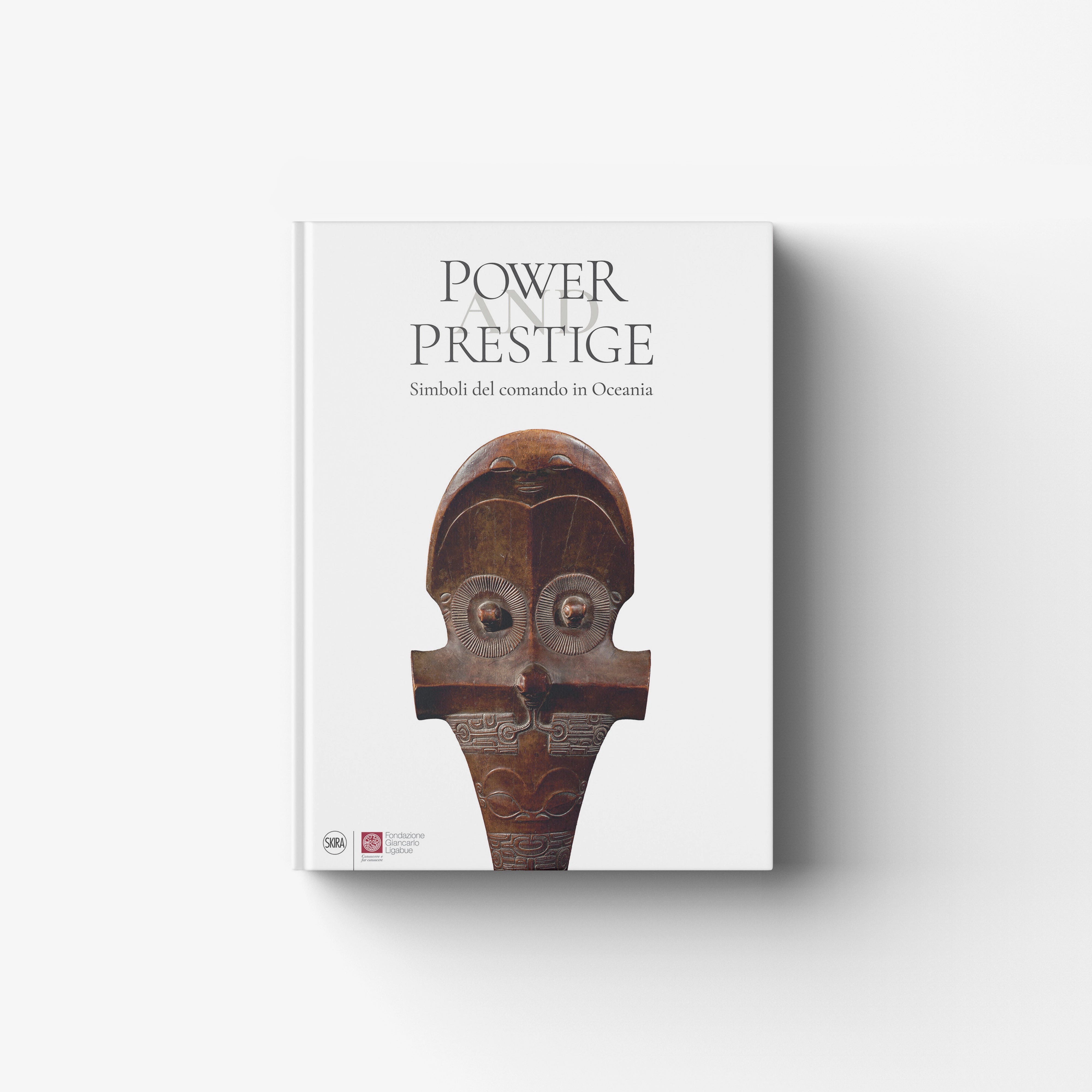 Art book in Italian edition by Skira Arte, white cover with Power and Prestige title and carved Oceania figure