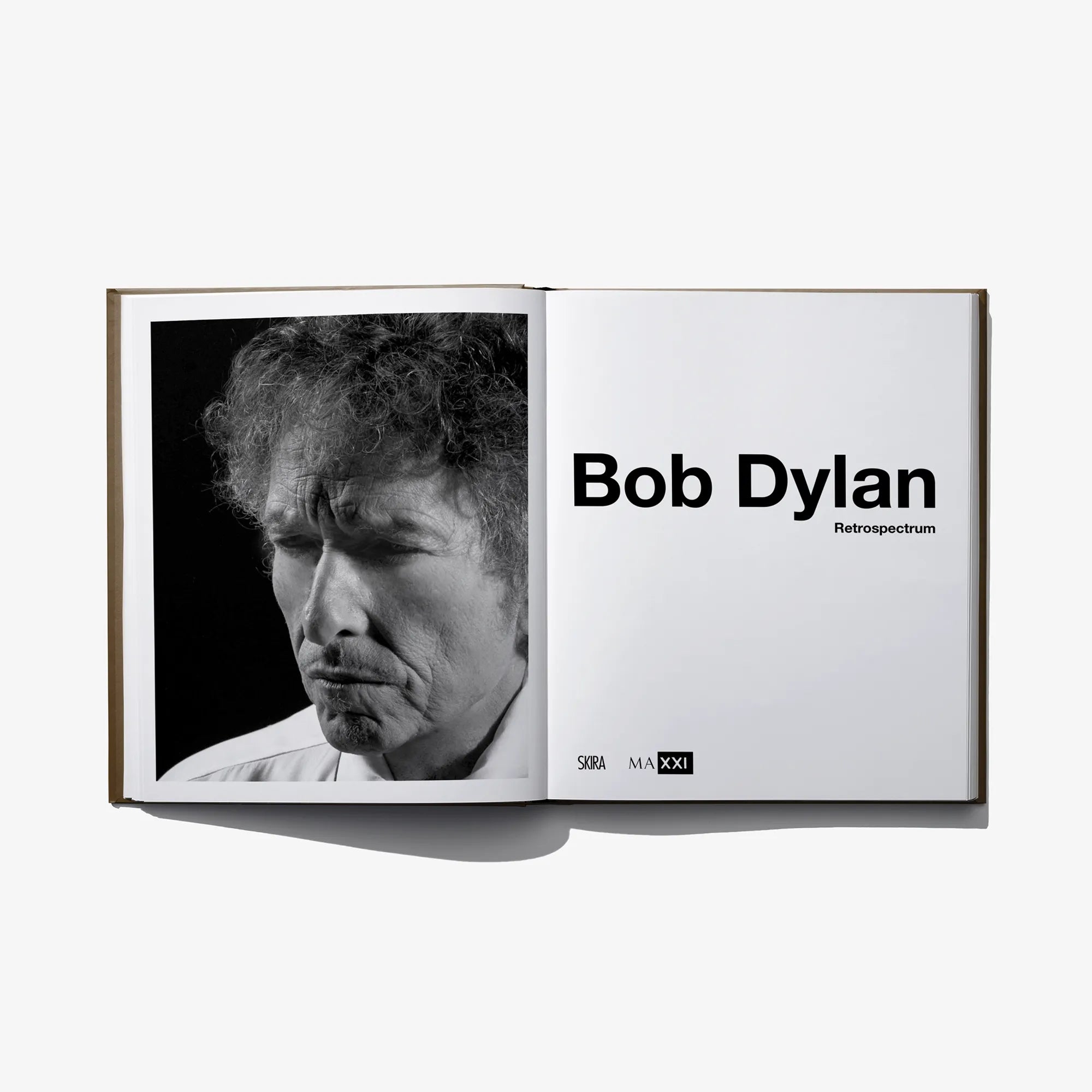 Open book with black-and-white portrait photo and title text on right