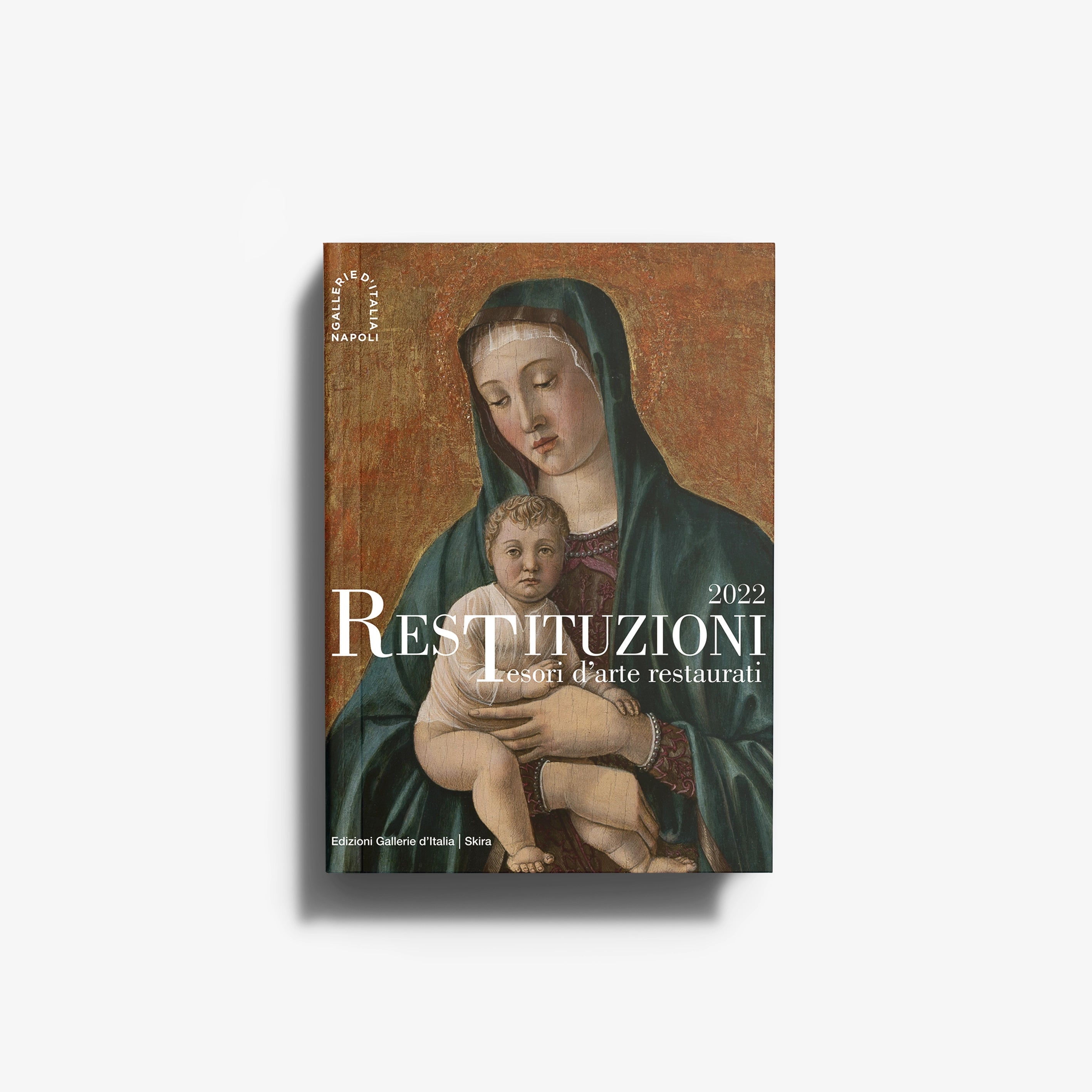 Art book Restituzioni 2022 by Skira Arte with restored heritage artworks cover featuring a Madonna and child illustration