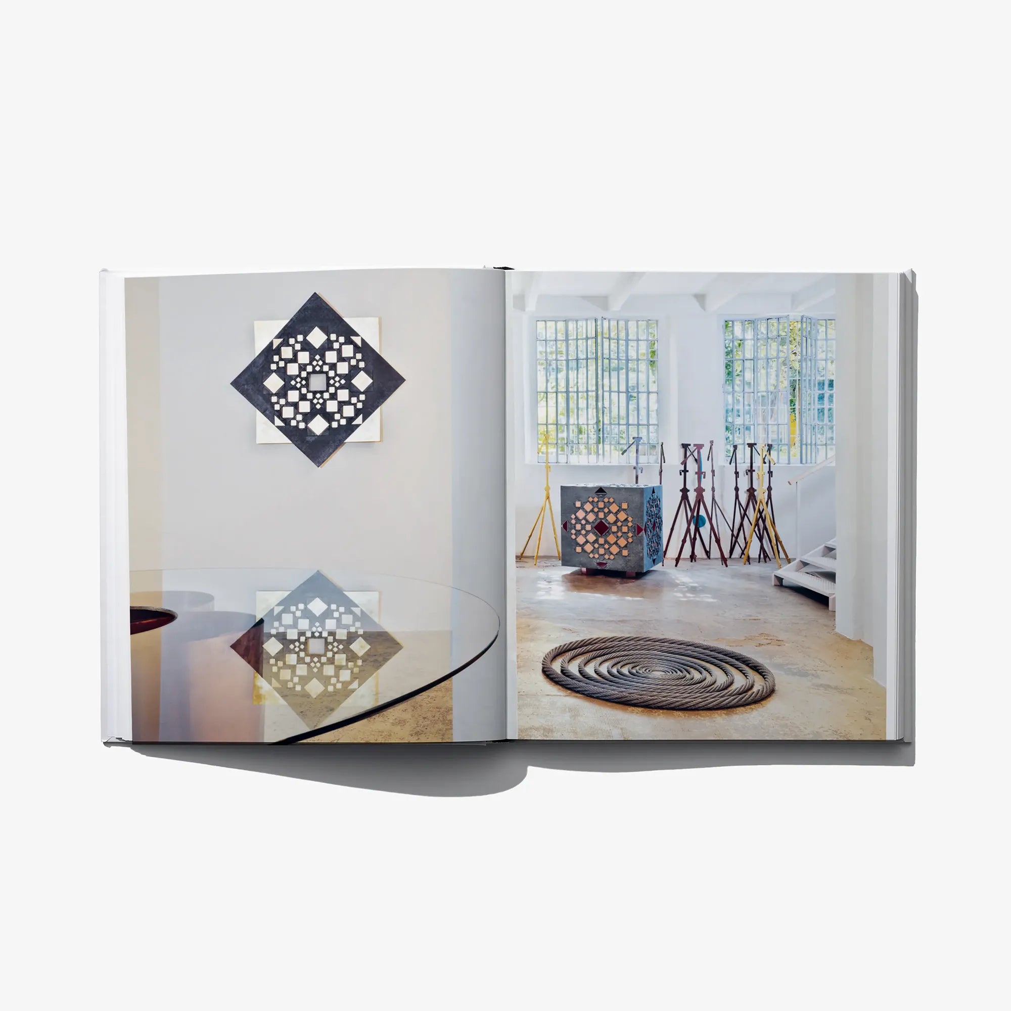 Italian edition art book open spread with interior photo and diamond mosaic graphic