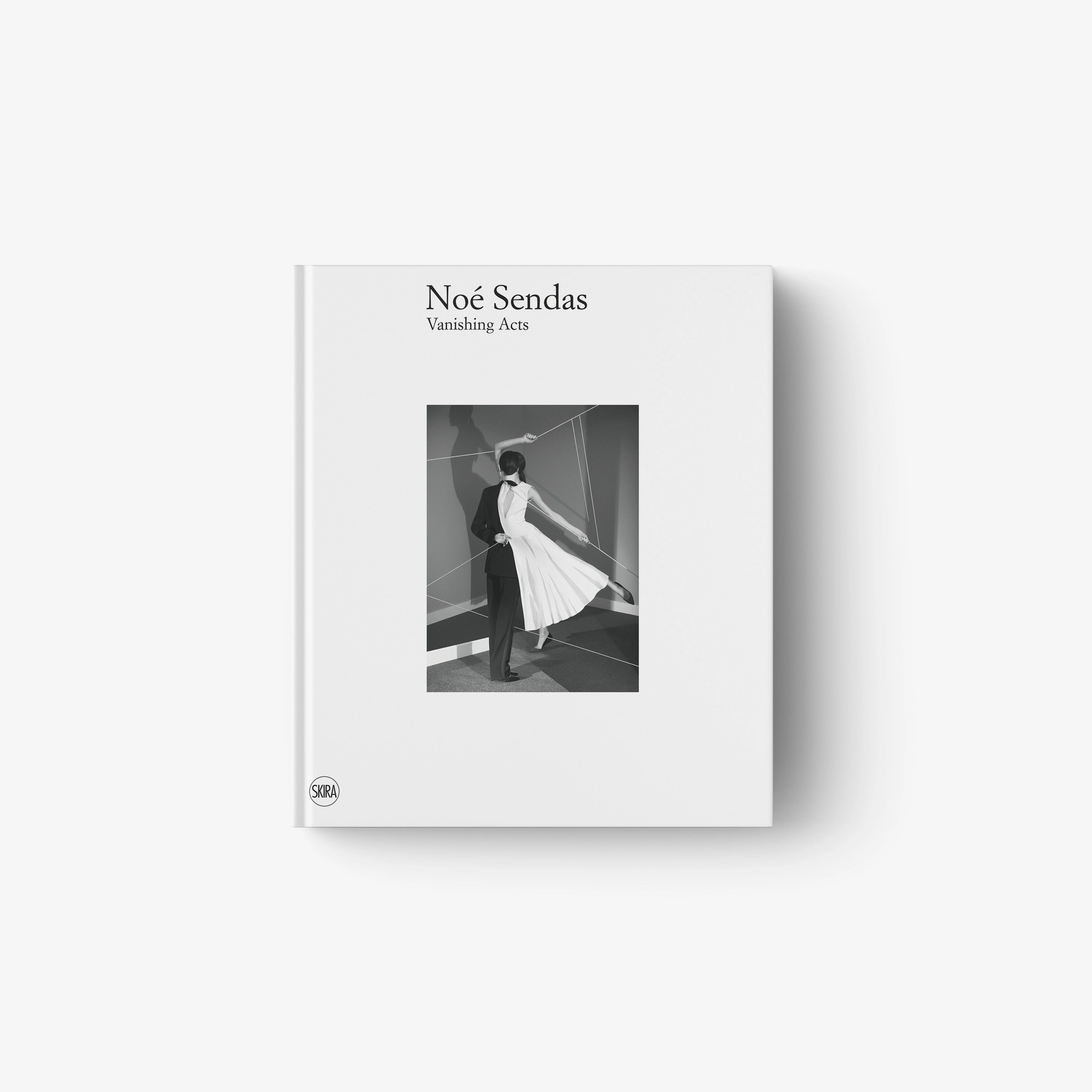 Minimalist white book cover featuring a black and white photo of a person walking in a flowing dress.