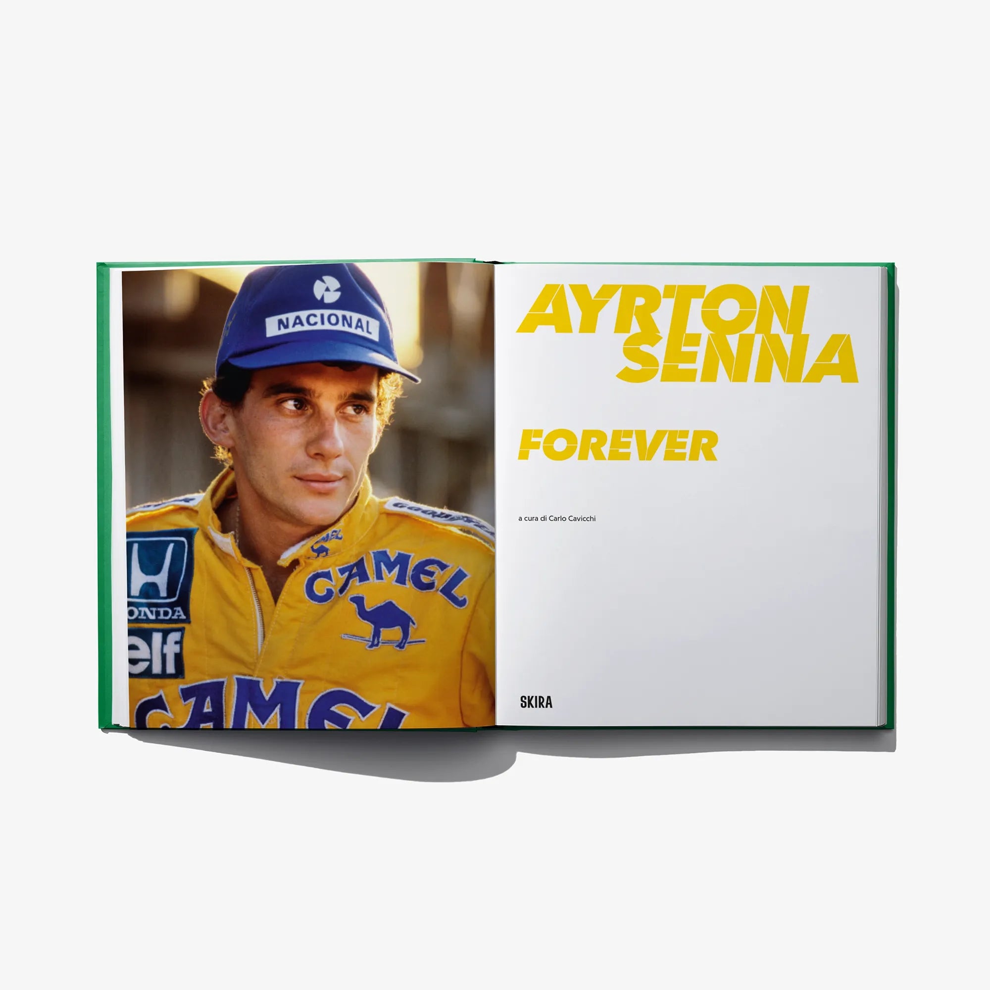 Ayrton Senna Forever book opened to title spread with driver in racing suit