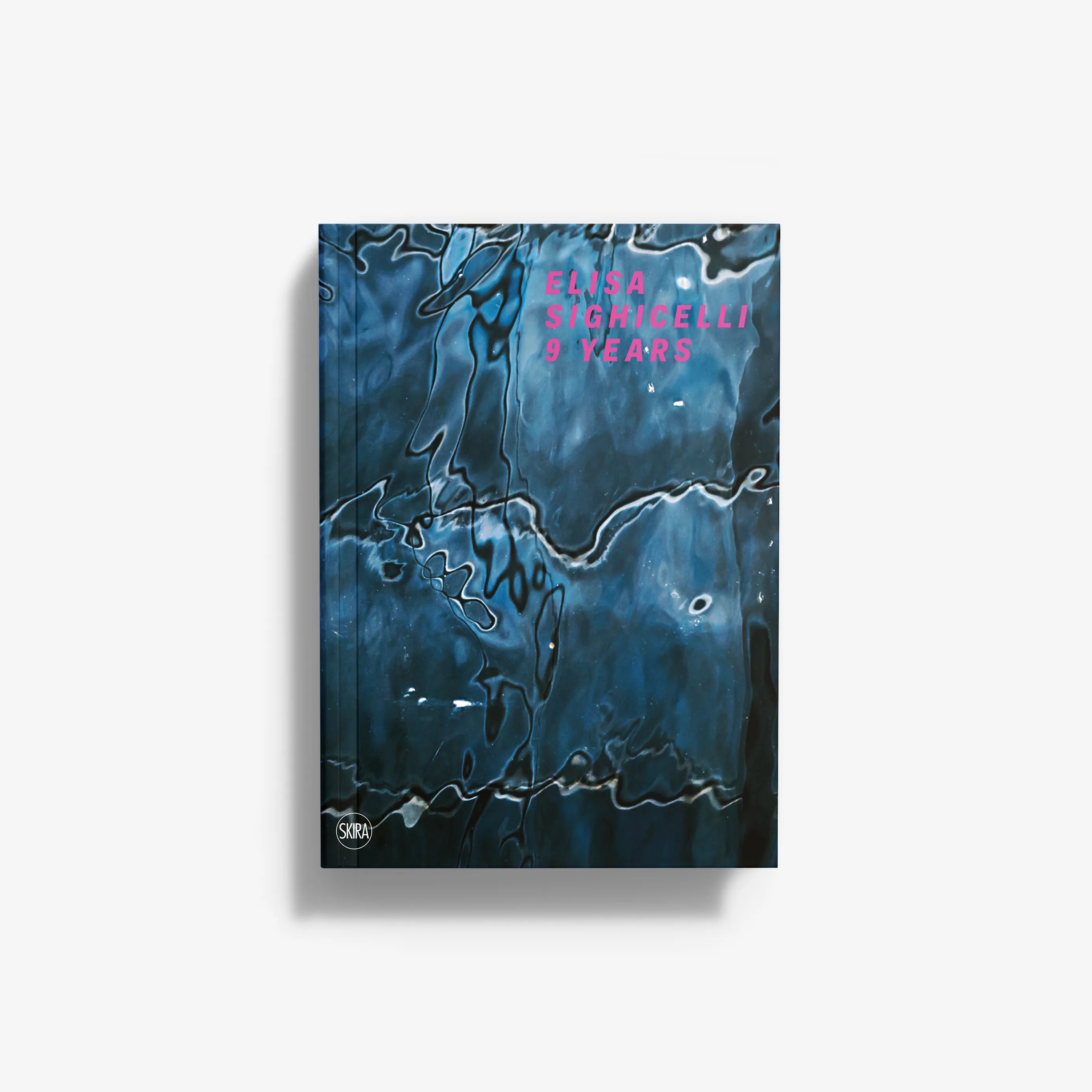 Book cover with abstract blue and black fluid patterns and pink text reading "Elisa Sighicelli 9 Years".