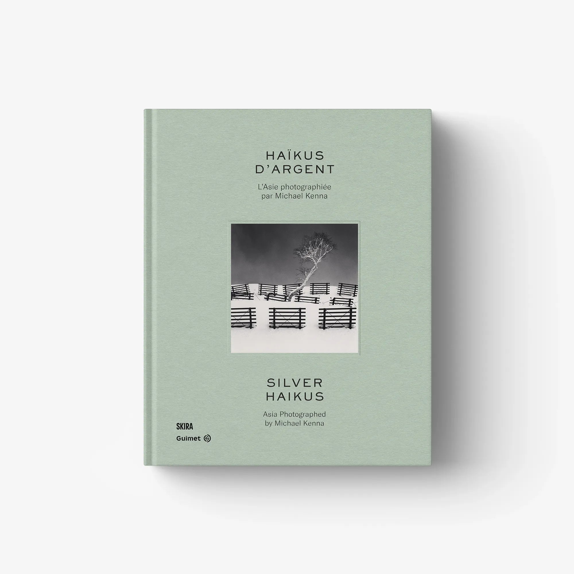 Mint green photo book cover with small landscape thumbnail and centered title.