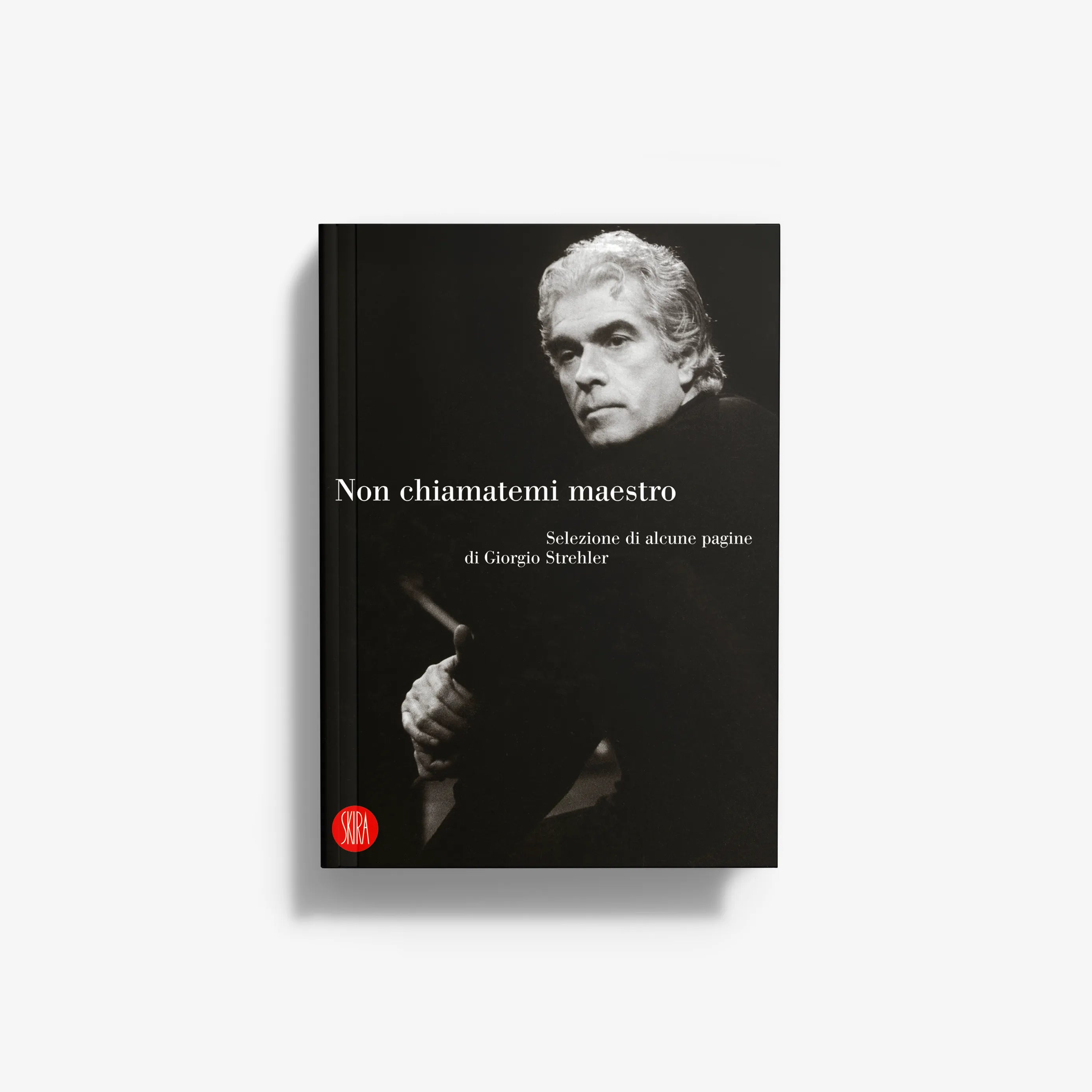Hardcover book with black cover, portrait of man, and Italian title text