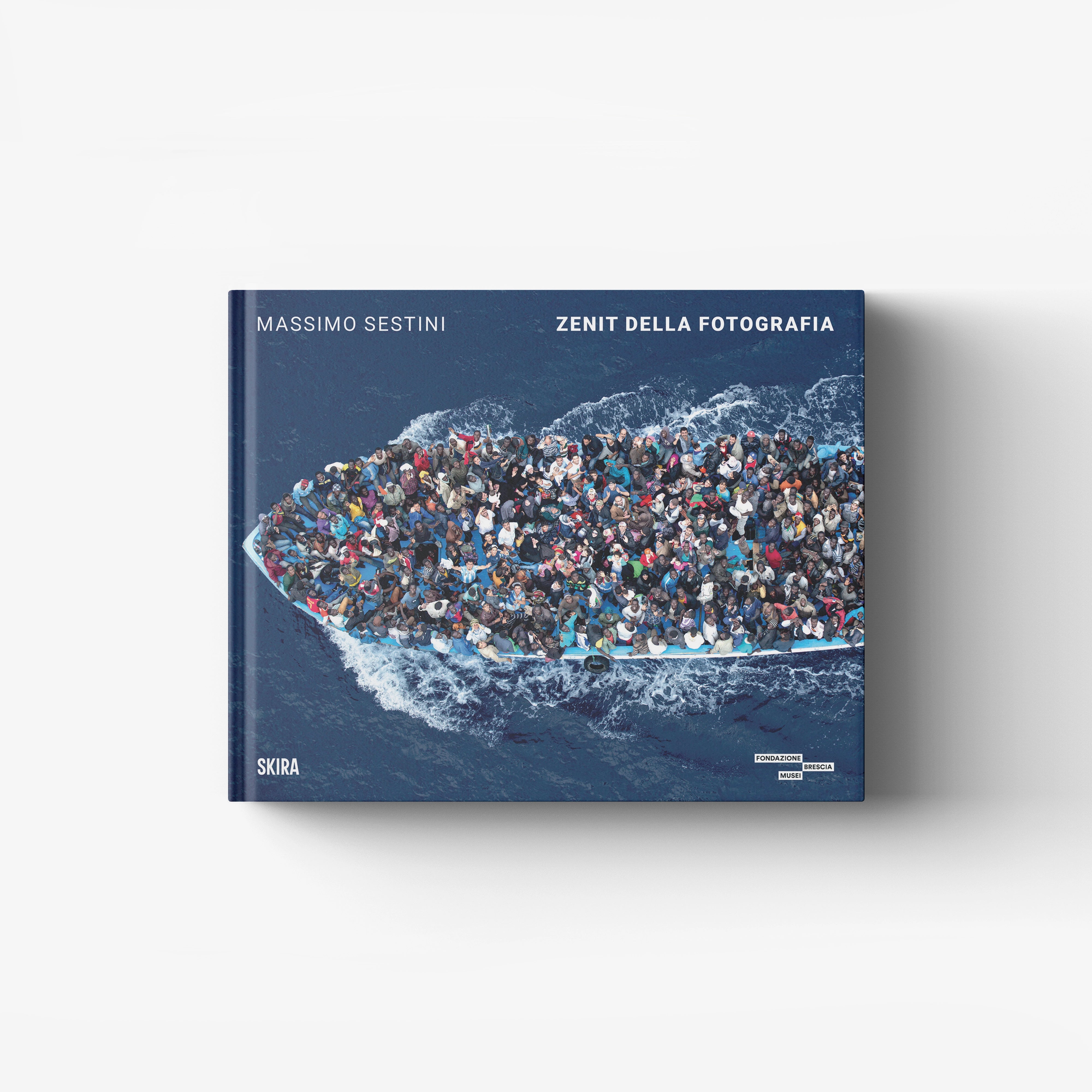 Hardback photography monograph in blue with crowd scene cover, Skira Arte, Massimo Sestini Zenit della fotografia
