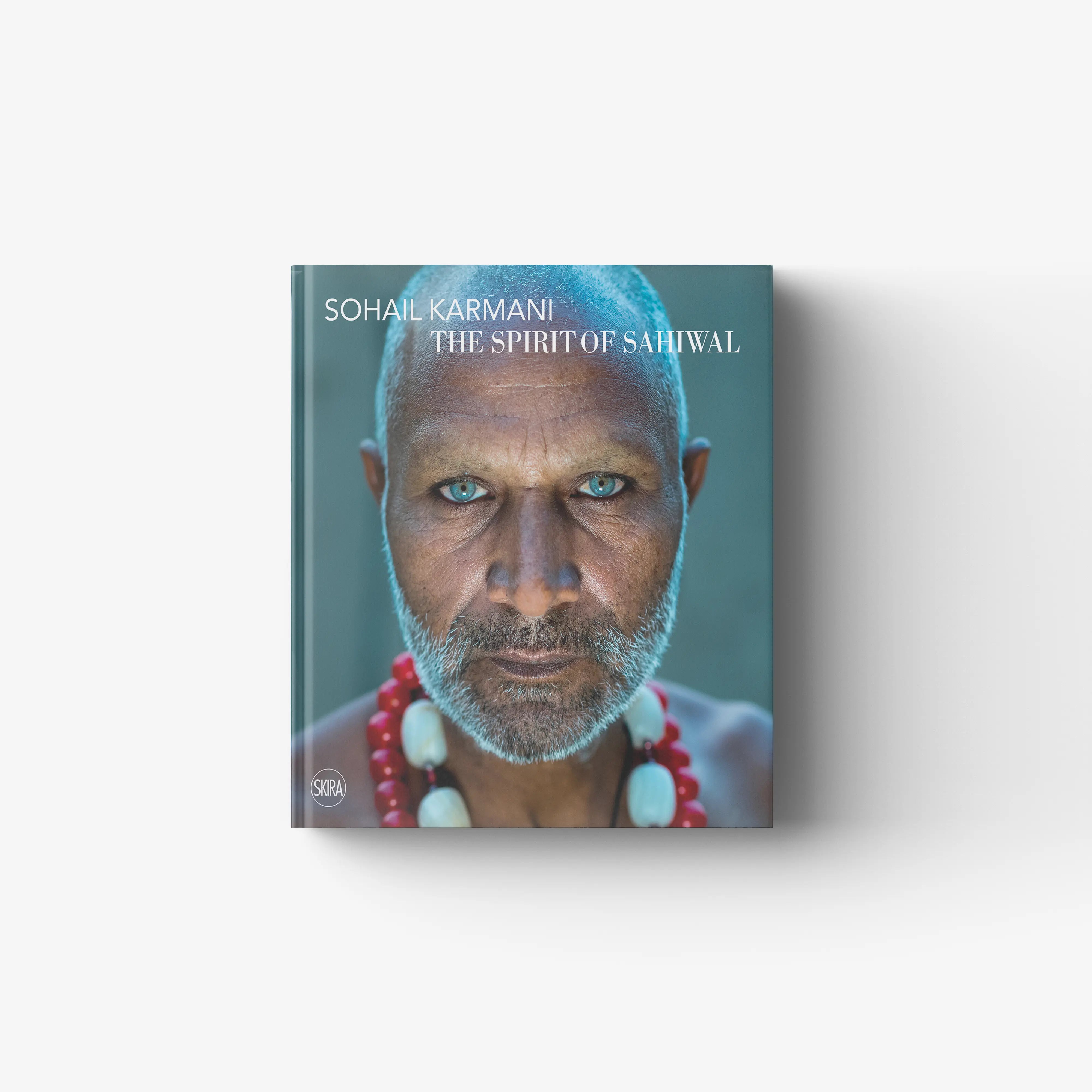 Art book portrait in teal cover with quasi pictorial texture, Skira Arte, Sohail Karmani The Spirit of Sahiwal