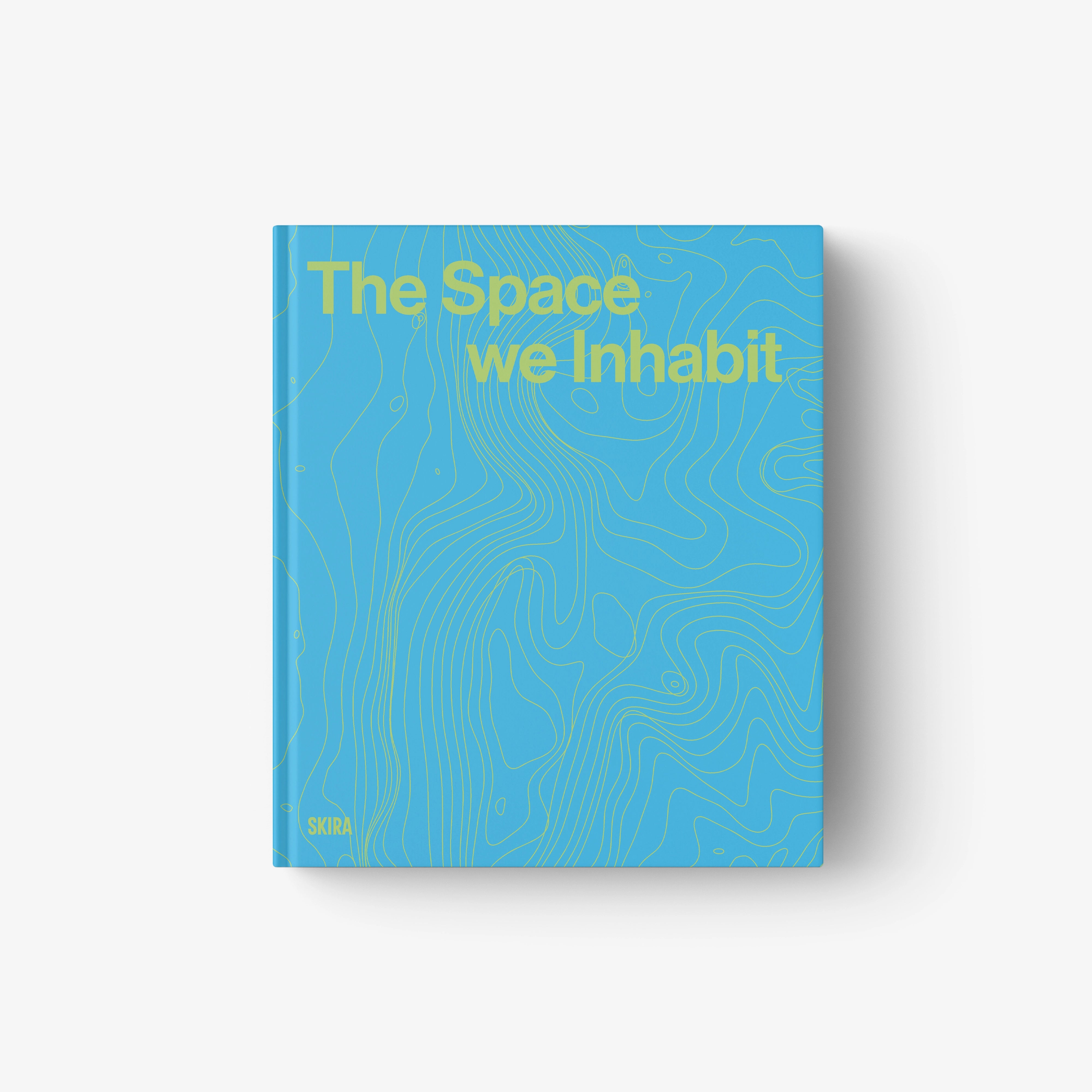 Blue topographic book cover with title text "The Space We Inhabit"