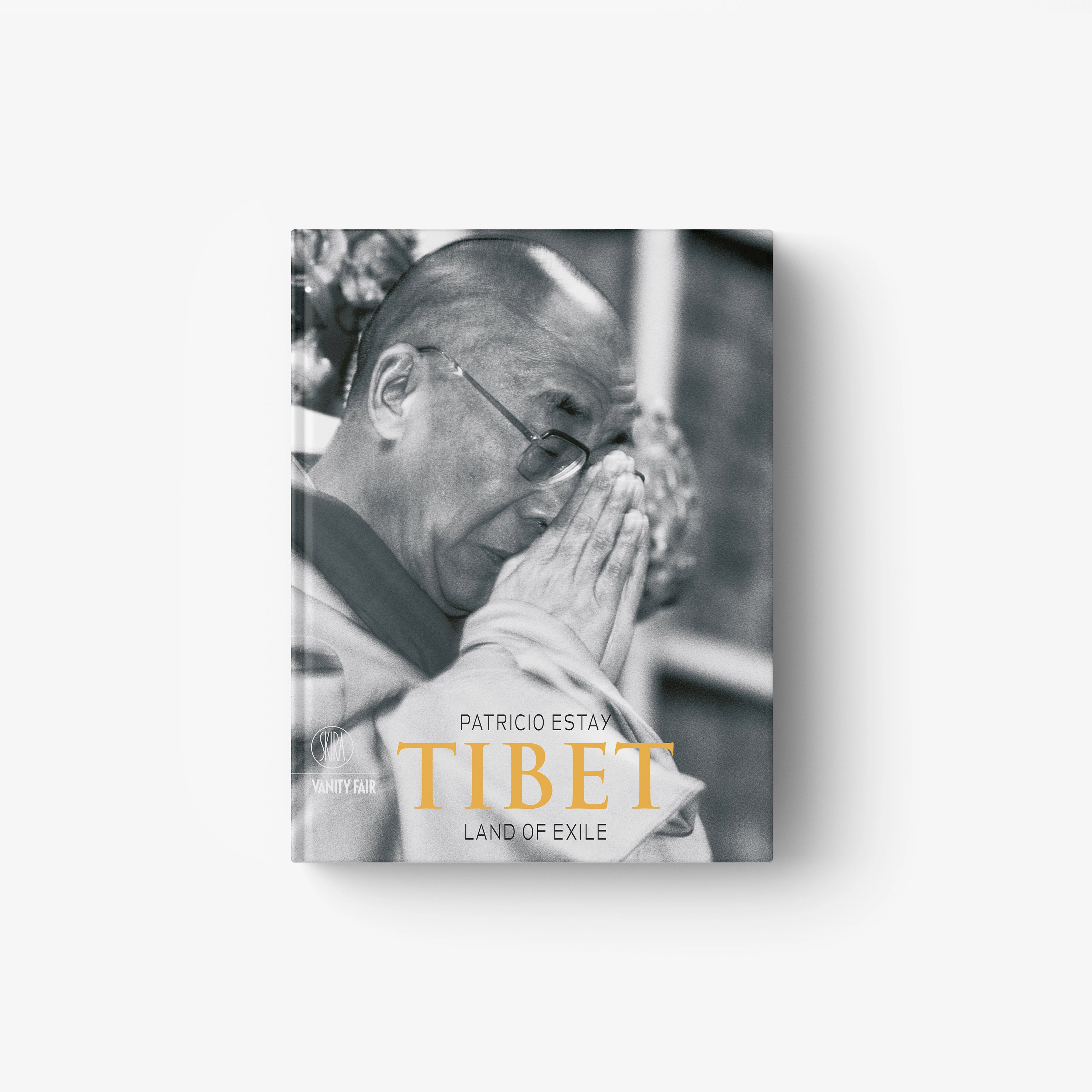 English edition book with prayerful man on cover and title "Tibet: Land of Exile"