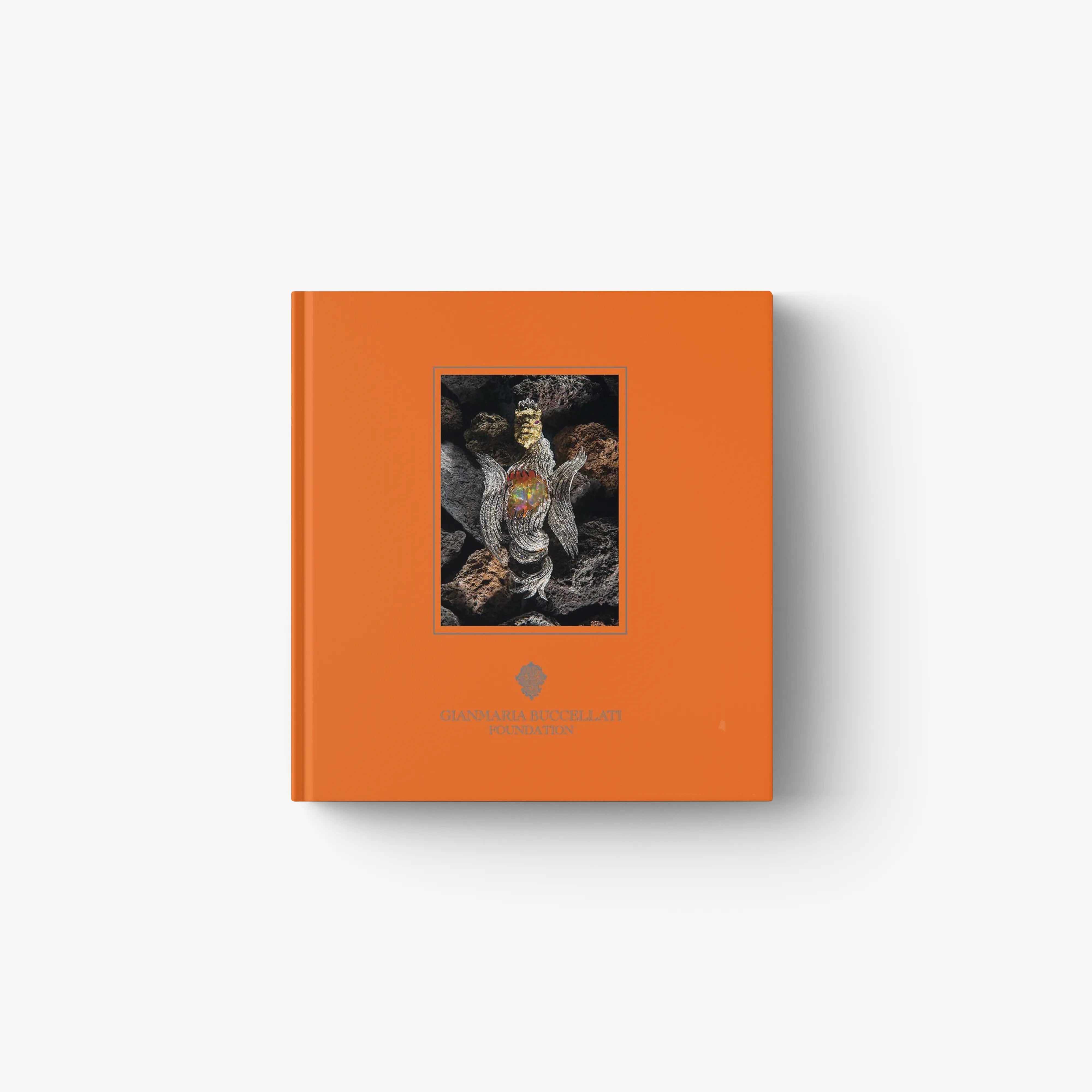 Hardback art book by Skira Arte with orange cover and framed jewellery photo, copertina rigida