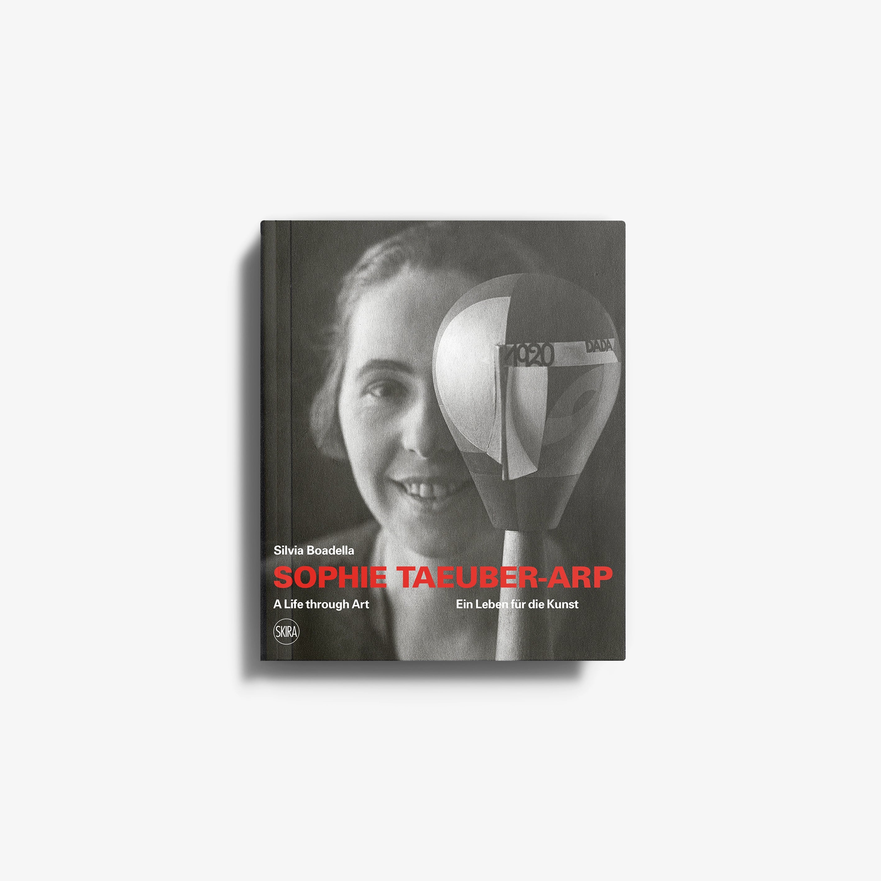Contemporary art portrait print by Skira Arte, dark grey book cover with Sophie Taeuber-Arp face and geometric shapes