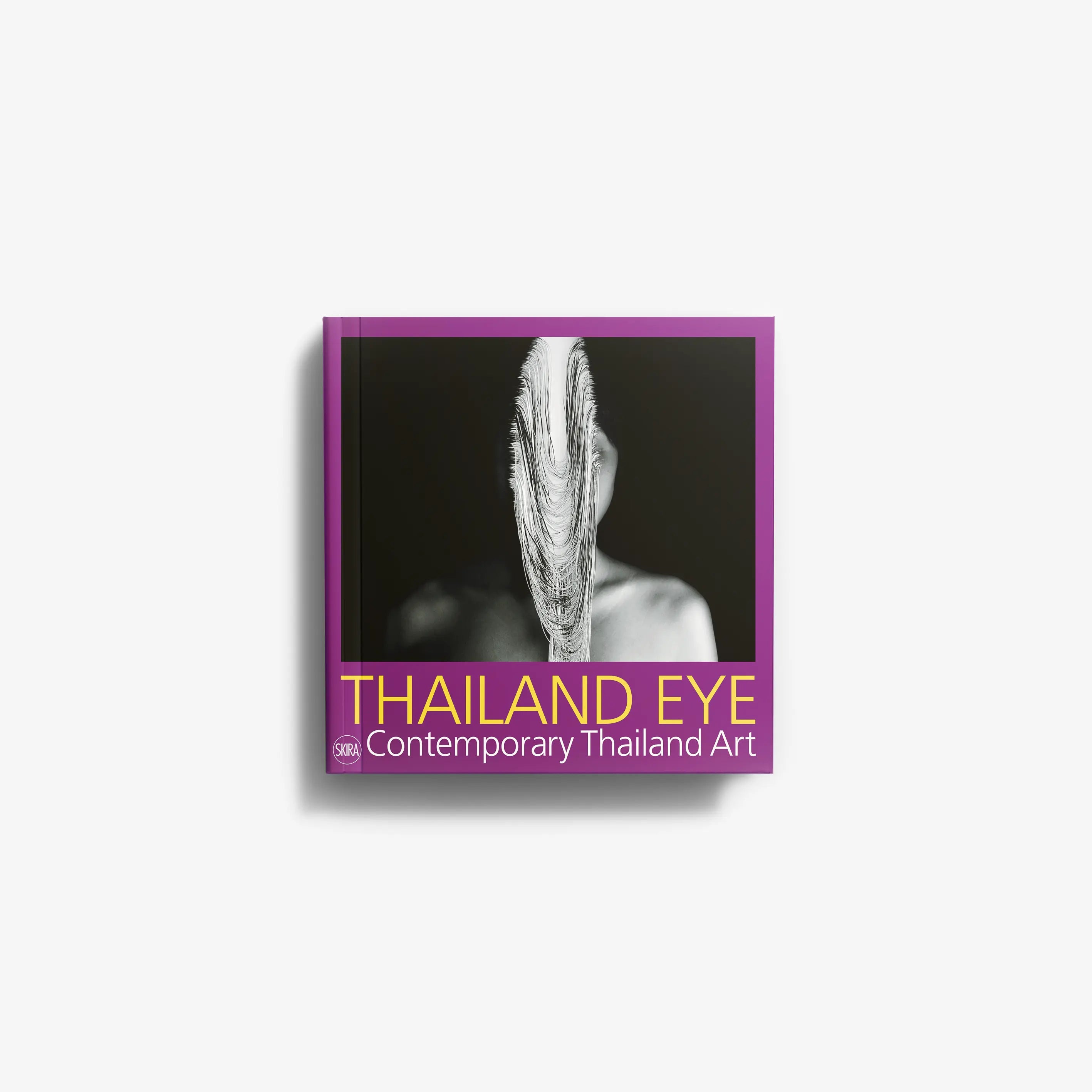 Contemporary Thai art book cover with monochrome portrait and title lettering