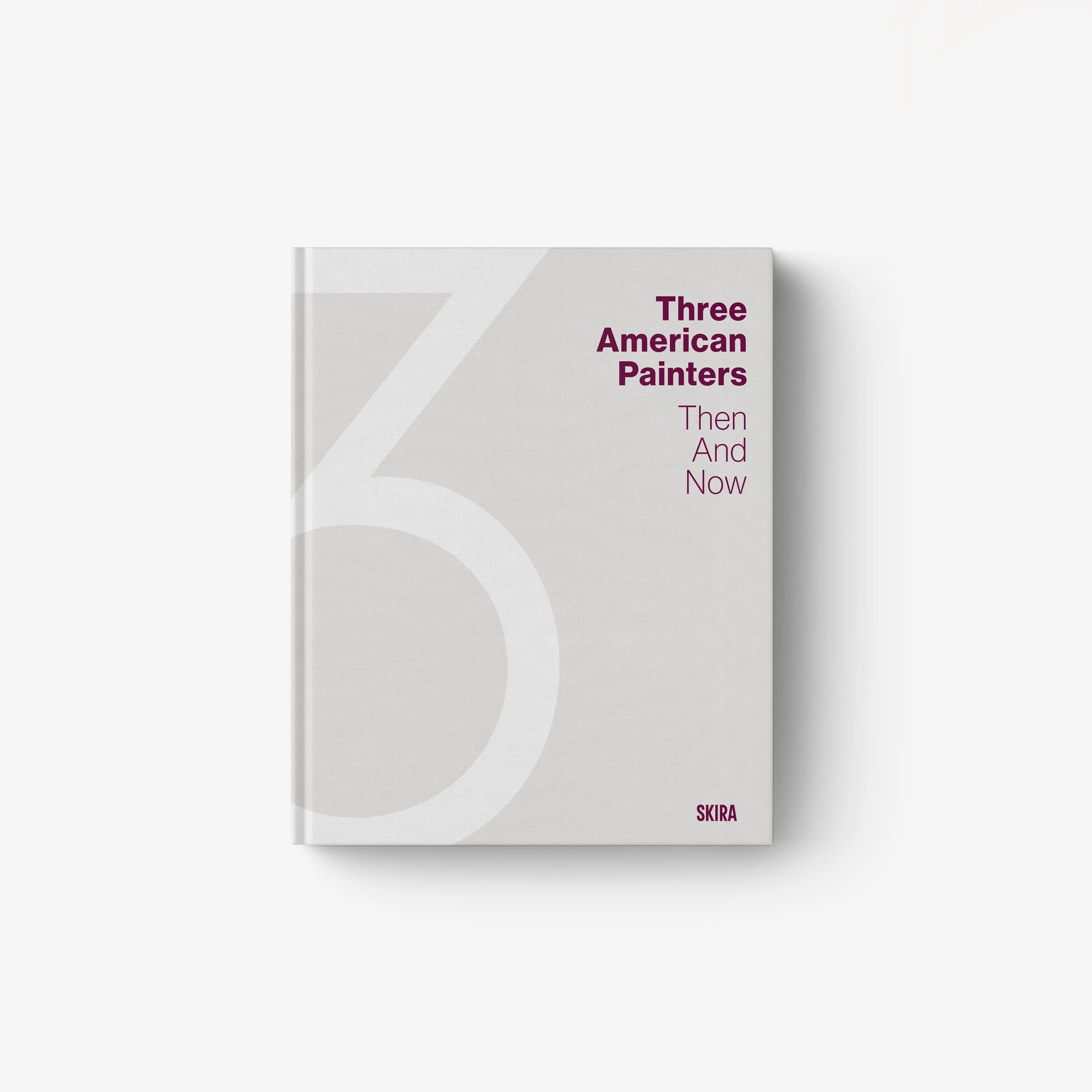 Hardcover art book with light gray cover, large geometric design, and red title text
