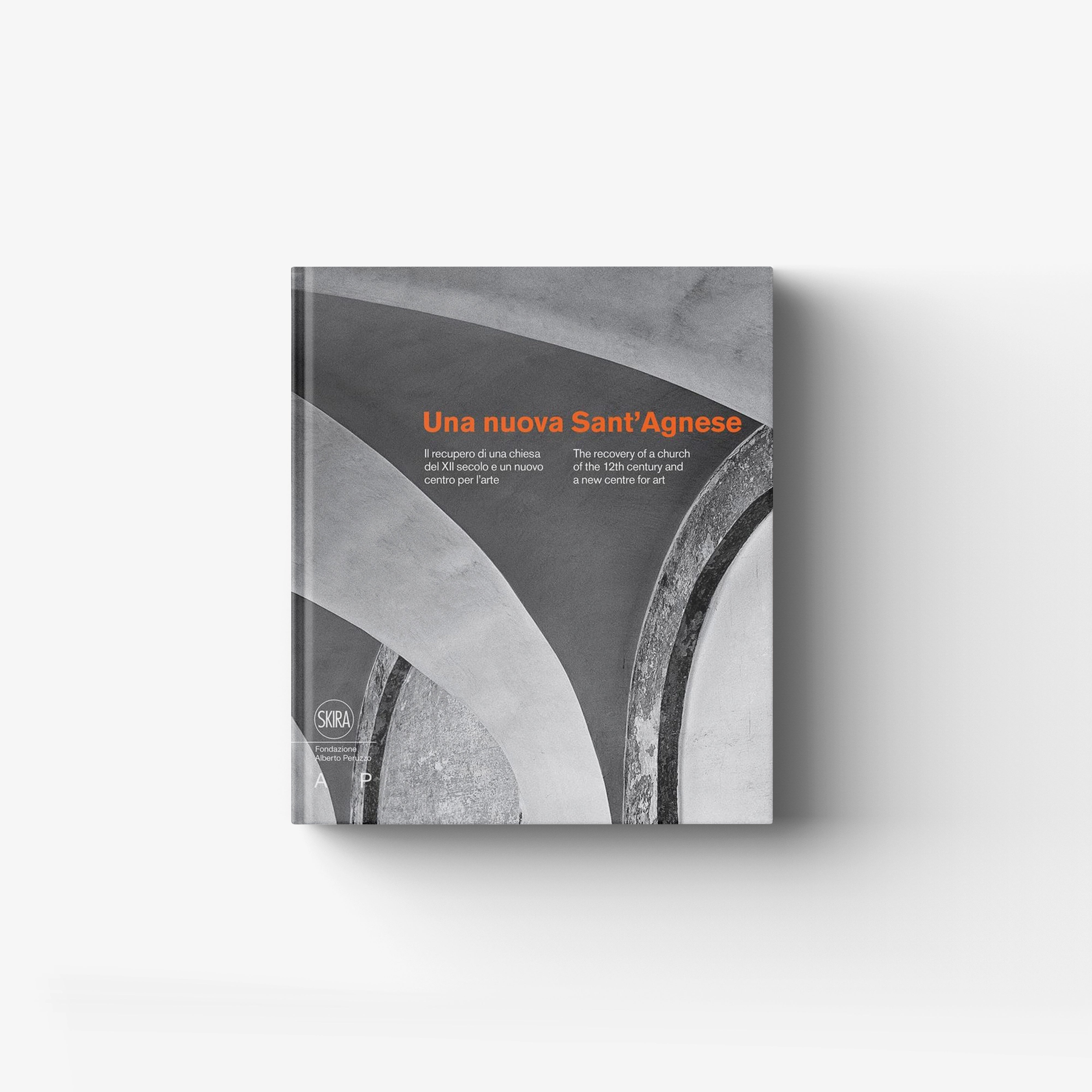 Art book in grey with orange title Una nuova Sant'Agnese by Skira Arte, with 12th century church recovery theme
