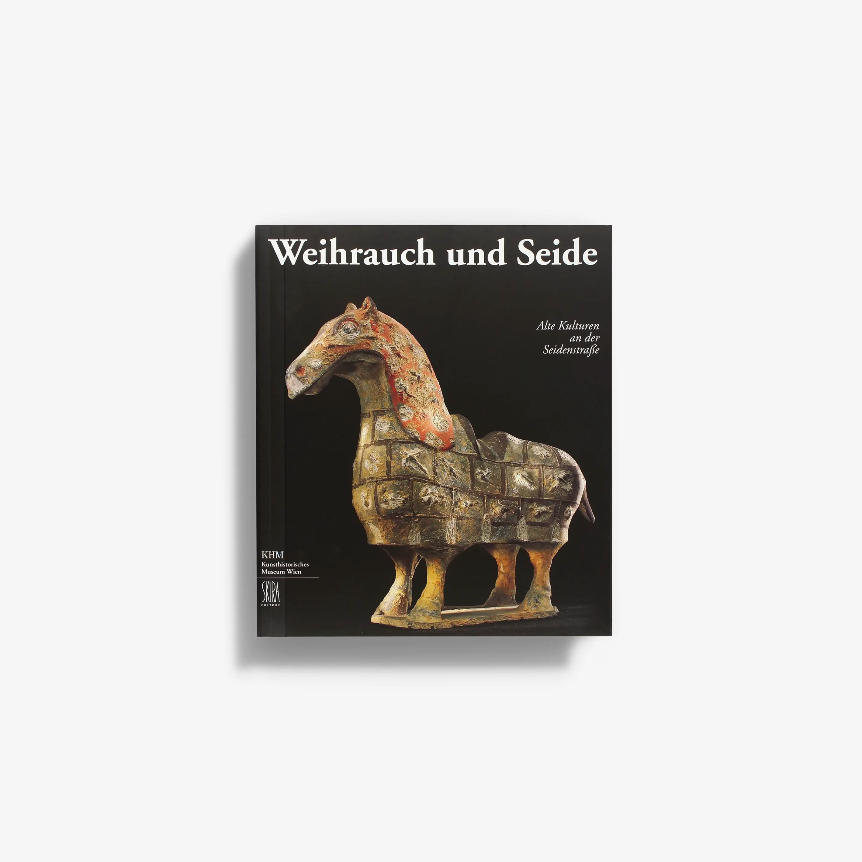 Hardback book by Skira Arte titled Weirauch und Seide with black cover and horse figurine on front